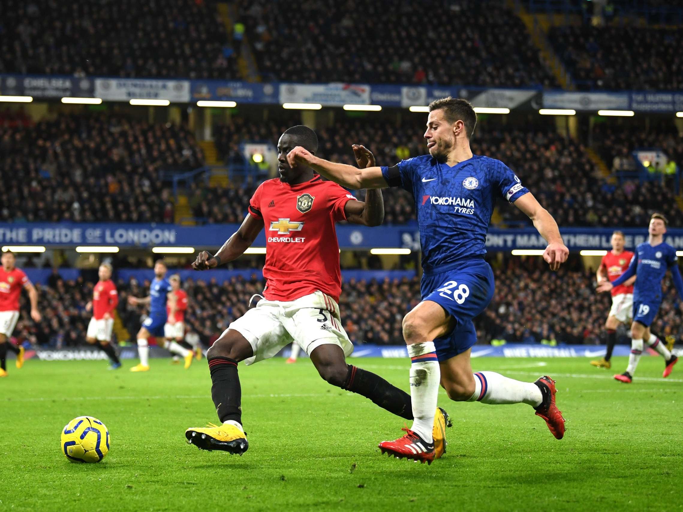 Eric Bailly holds off Chelsea captain Cesar Azpilicueta