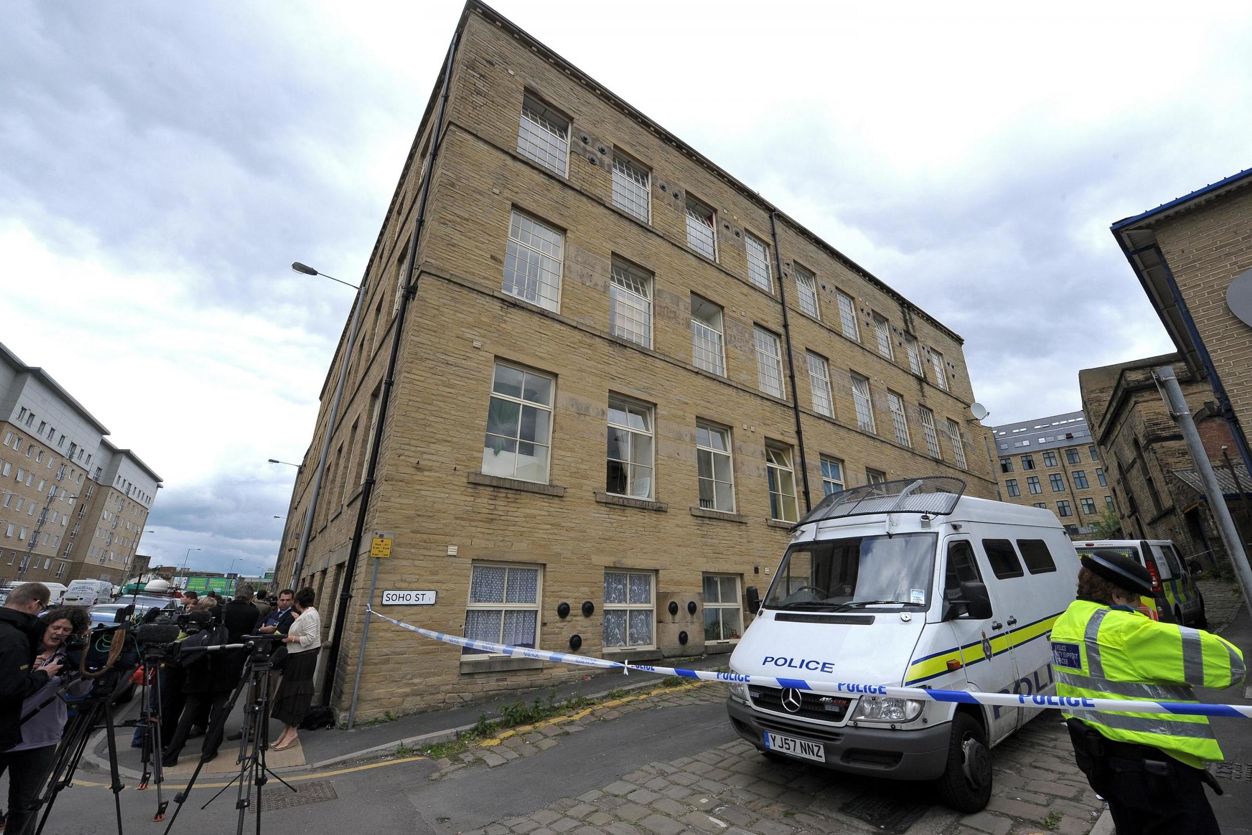 Police stand guard outside Holmfield Court where Griffiths lived (AFP via Getty)