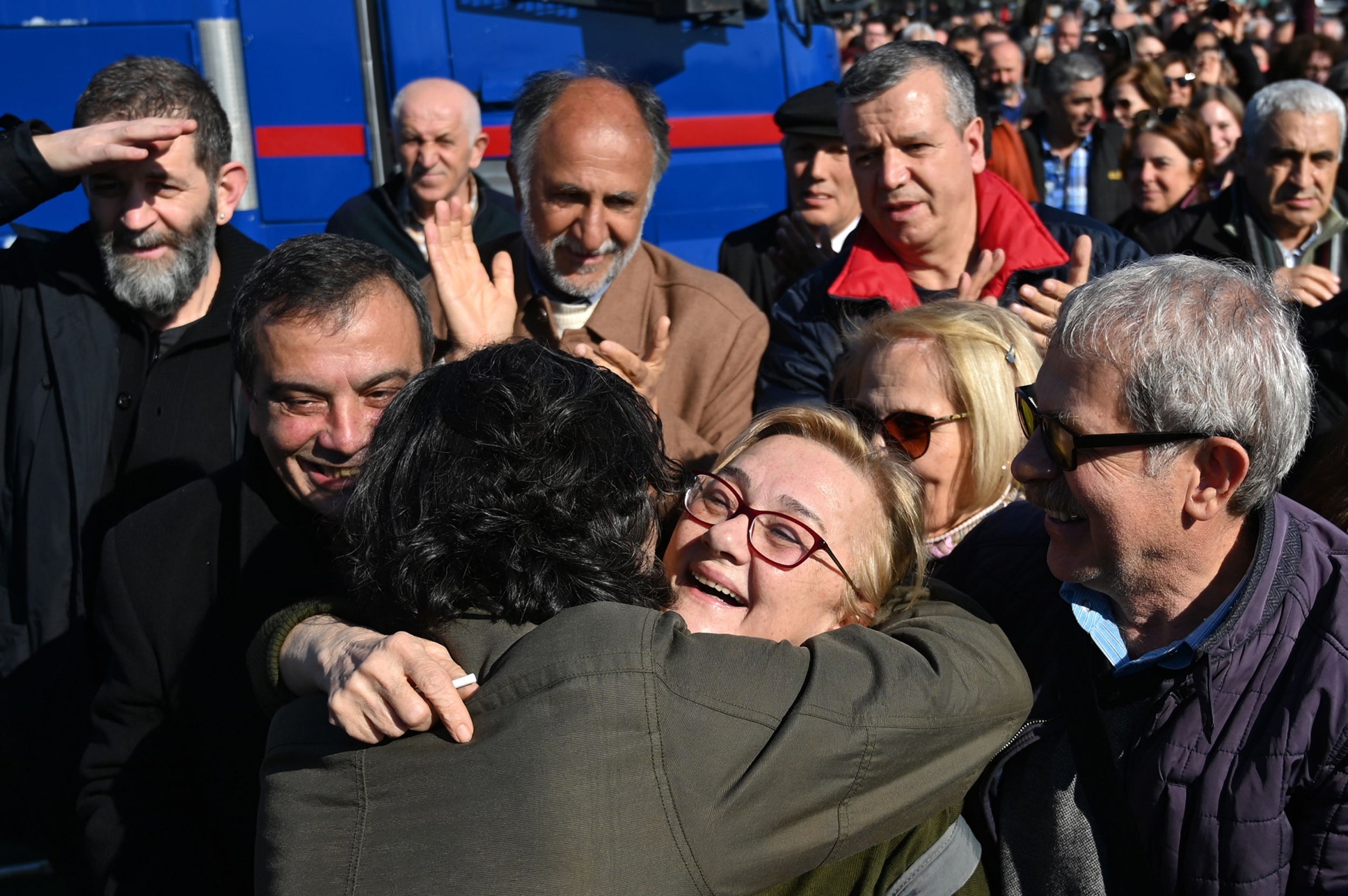 Mucella Yapici ( C ) of the Taksim Solidarity Platform celebrates outside Silivri Prison near Istanbul