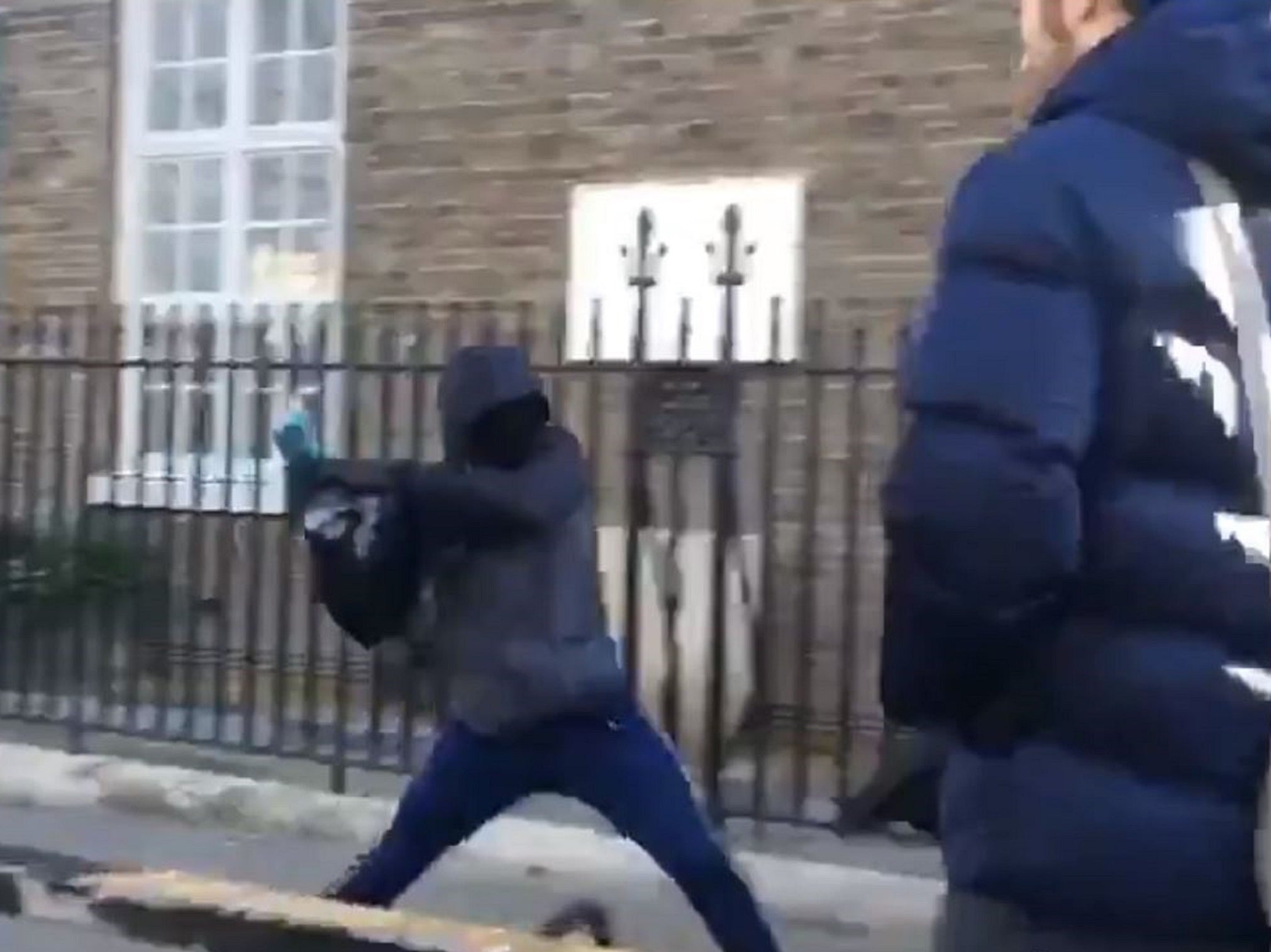 Screen grab of a group of four youngsters using an angle grinder to steal a bike outside London Fields Primary School in Hackney, east London.