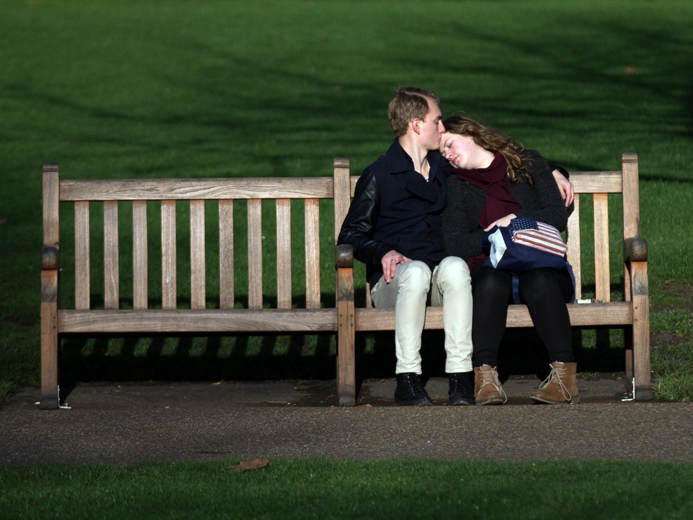 Couple enjoy the sun in Saint James Park London