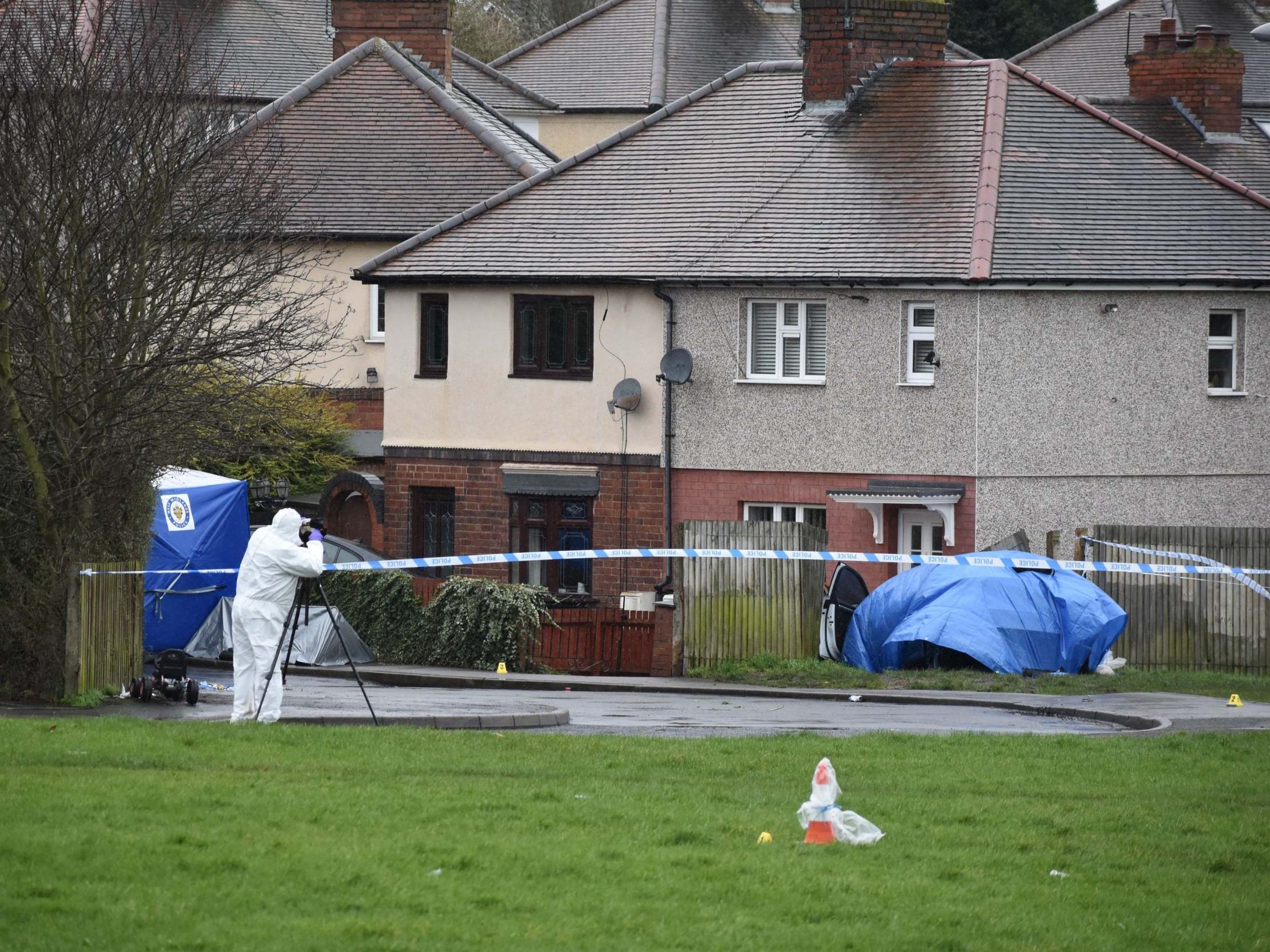 Police at the scene of a double murder in Pensnett Road, Brierley Hill, West Midlands, where two men were stabbed to death during a suspected robbery at a cannabis factory, 20 February 2020.