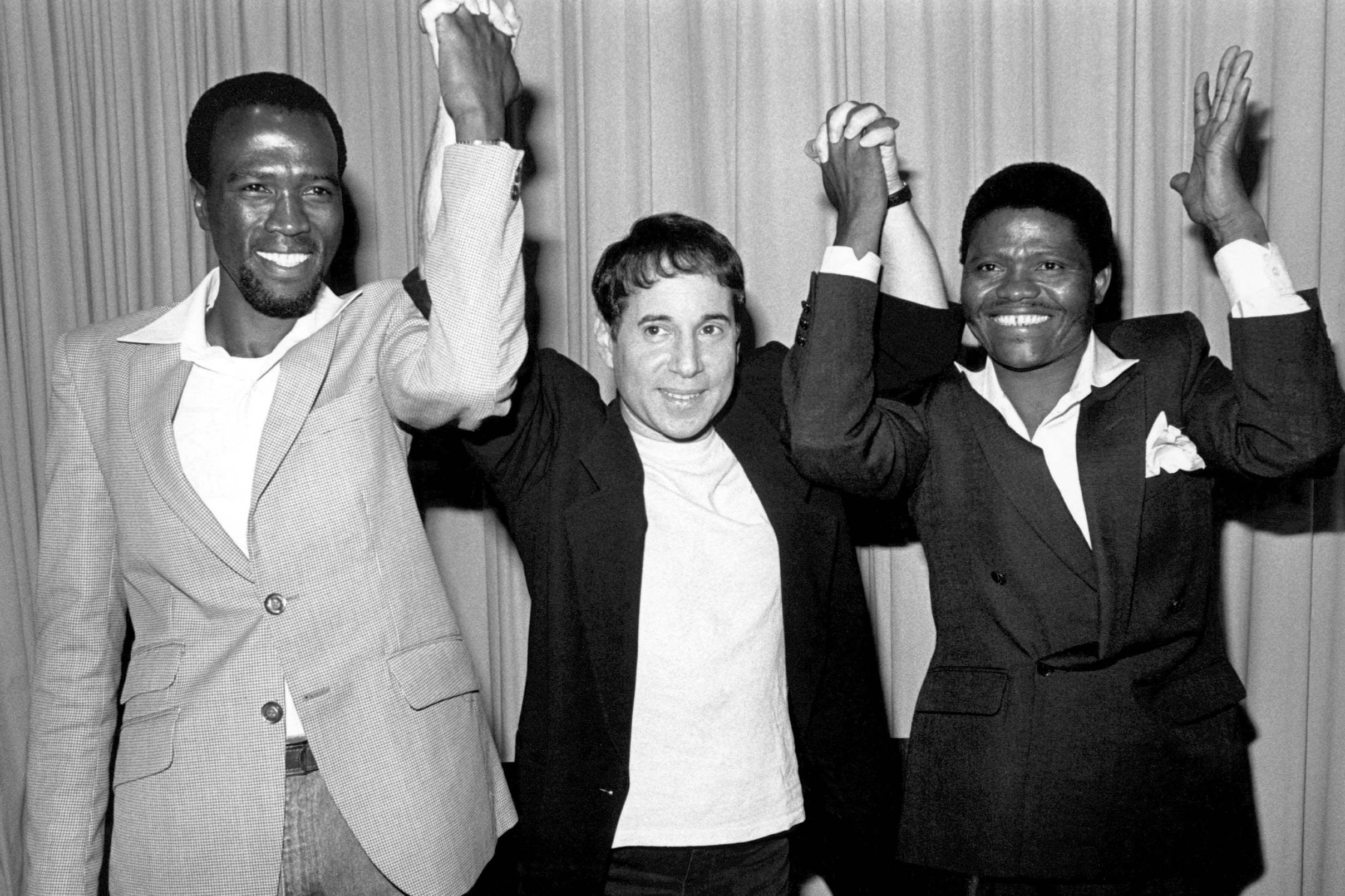 Shabalala (right) and fellow Ladysmith Black Mambazo member Albert Mazibuko with Paul Simon in 1986