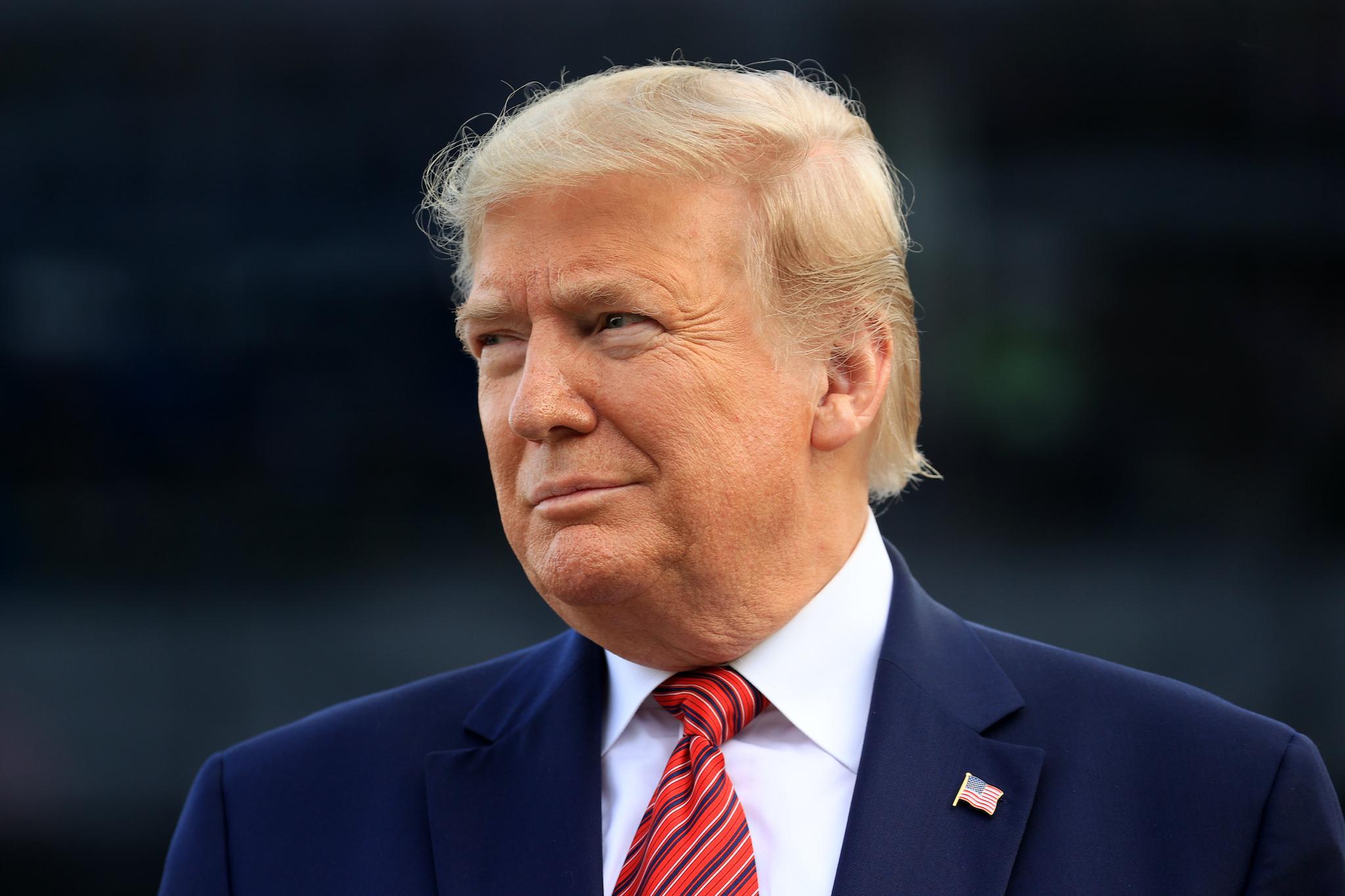 U.S. President Donald Trump looks on from pit road prior to the NASCAR Cup Series 62nd Annual Daytona 500 at Daytona International Speedway on February 16, 2020