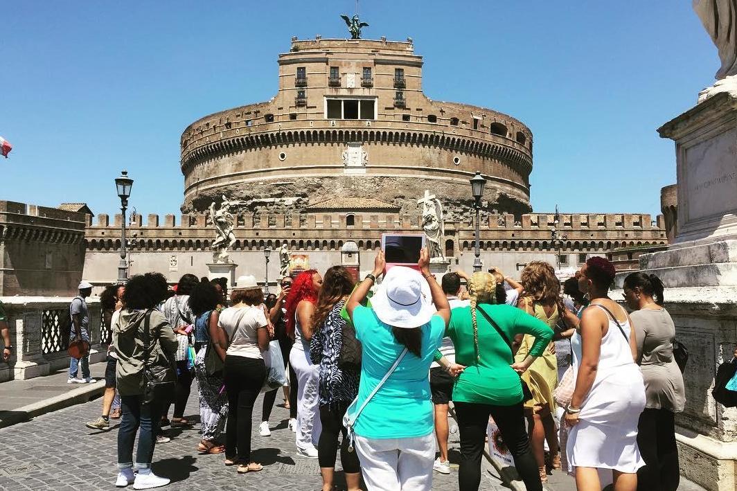 A Black Girl Travel tour group visits the Castel Sant'Angelo in Rome