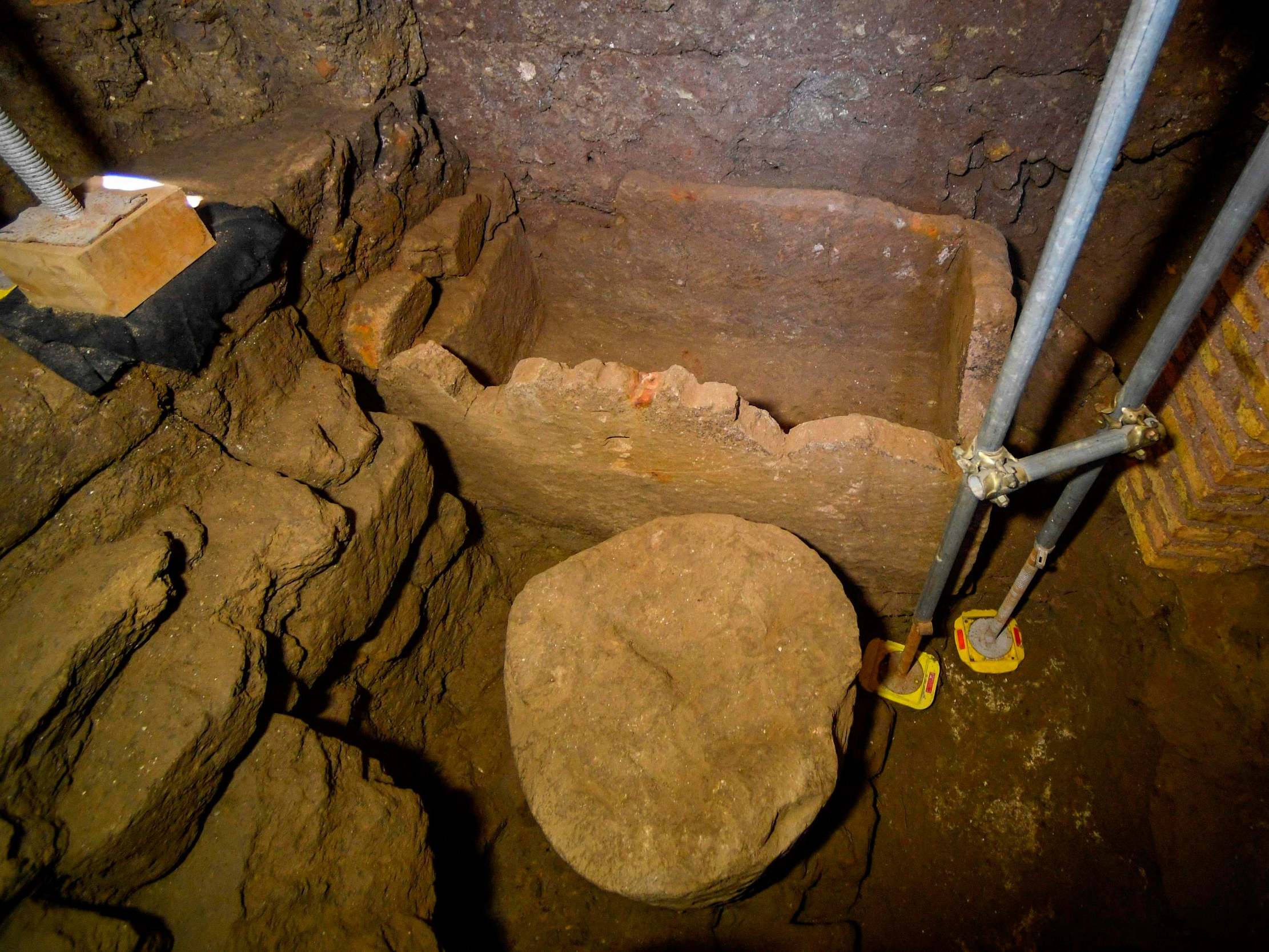 The 6th century BC stone sarcophagus, with an accompanying circular altar, was discovered under the Forum