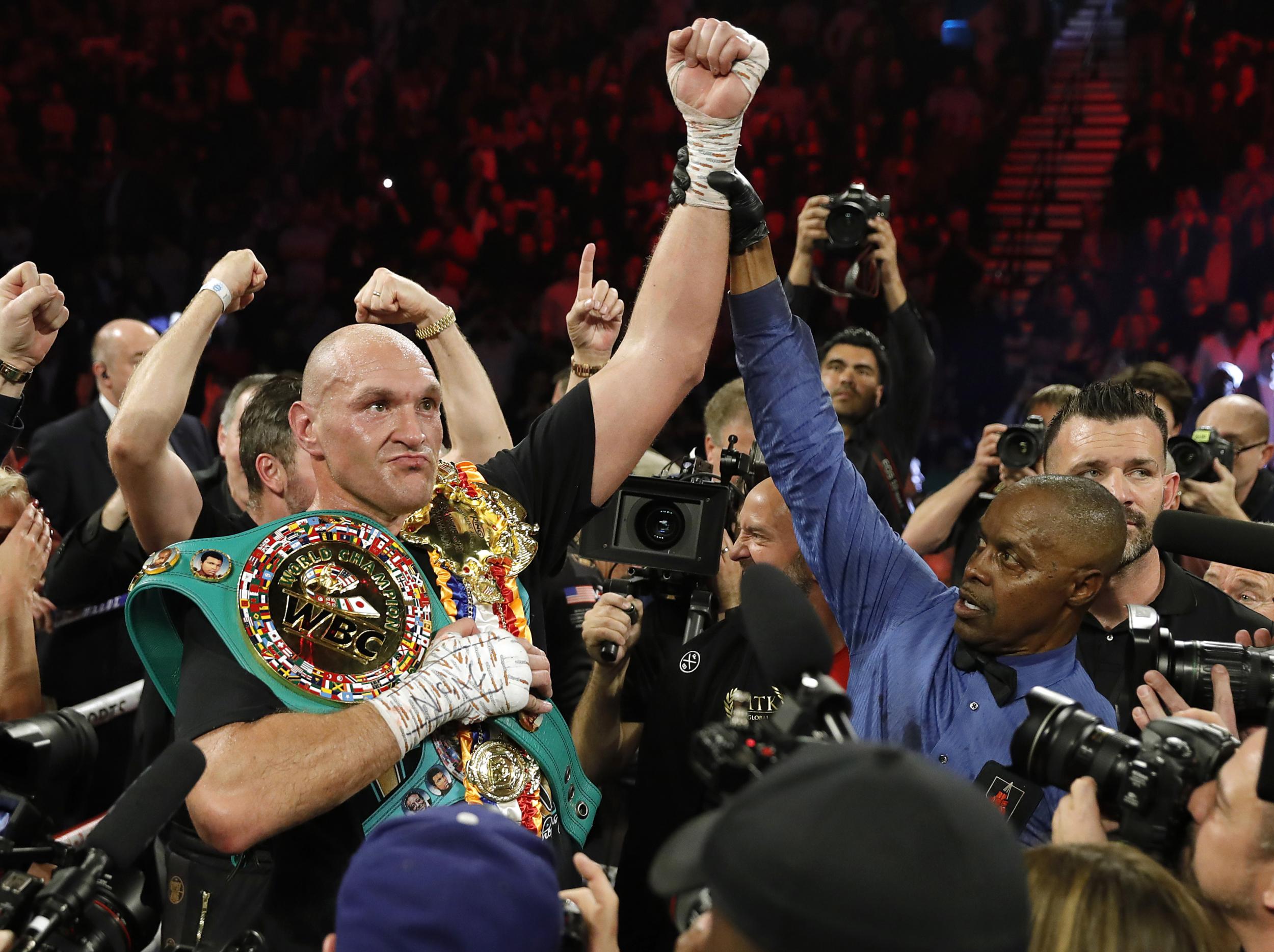 Tyson Fury celebrates in the ring