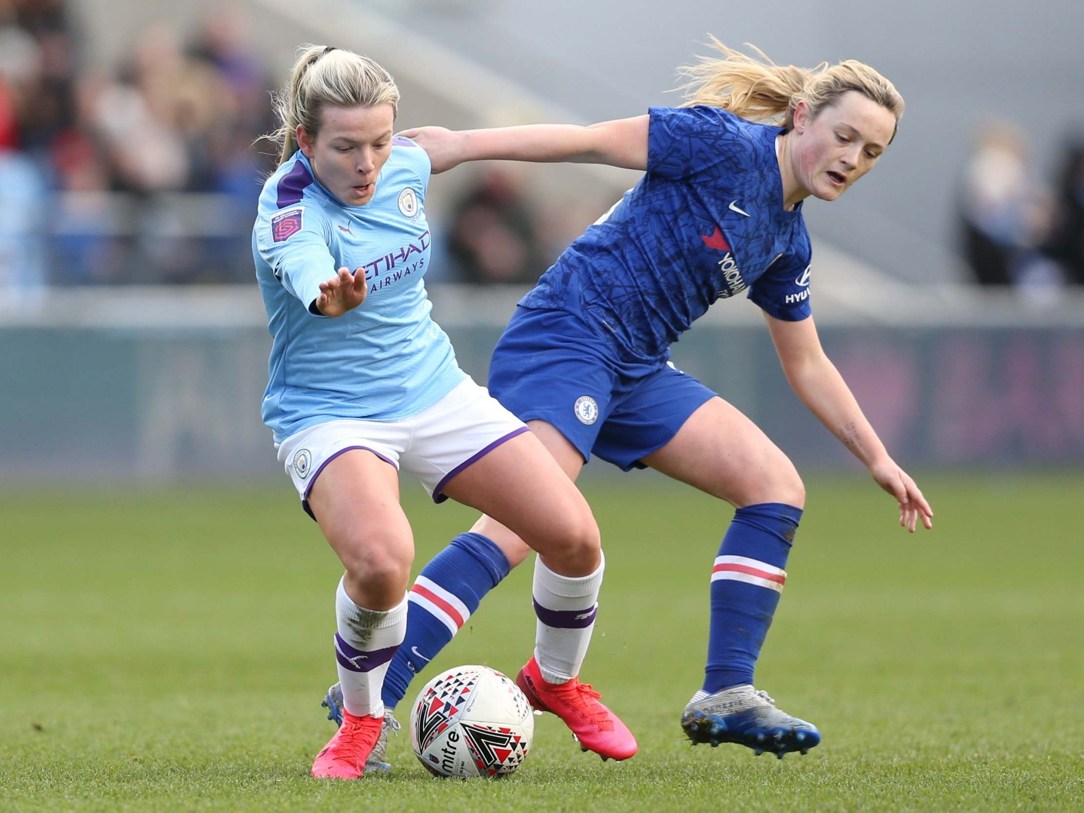 Lauren Hemp and Erin Cuthbert battle for the ball