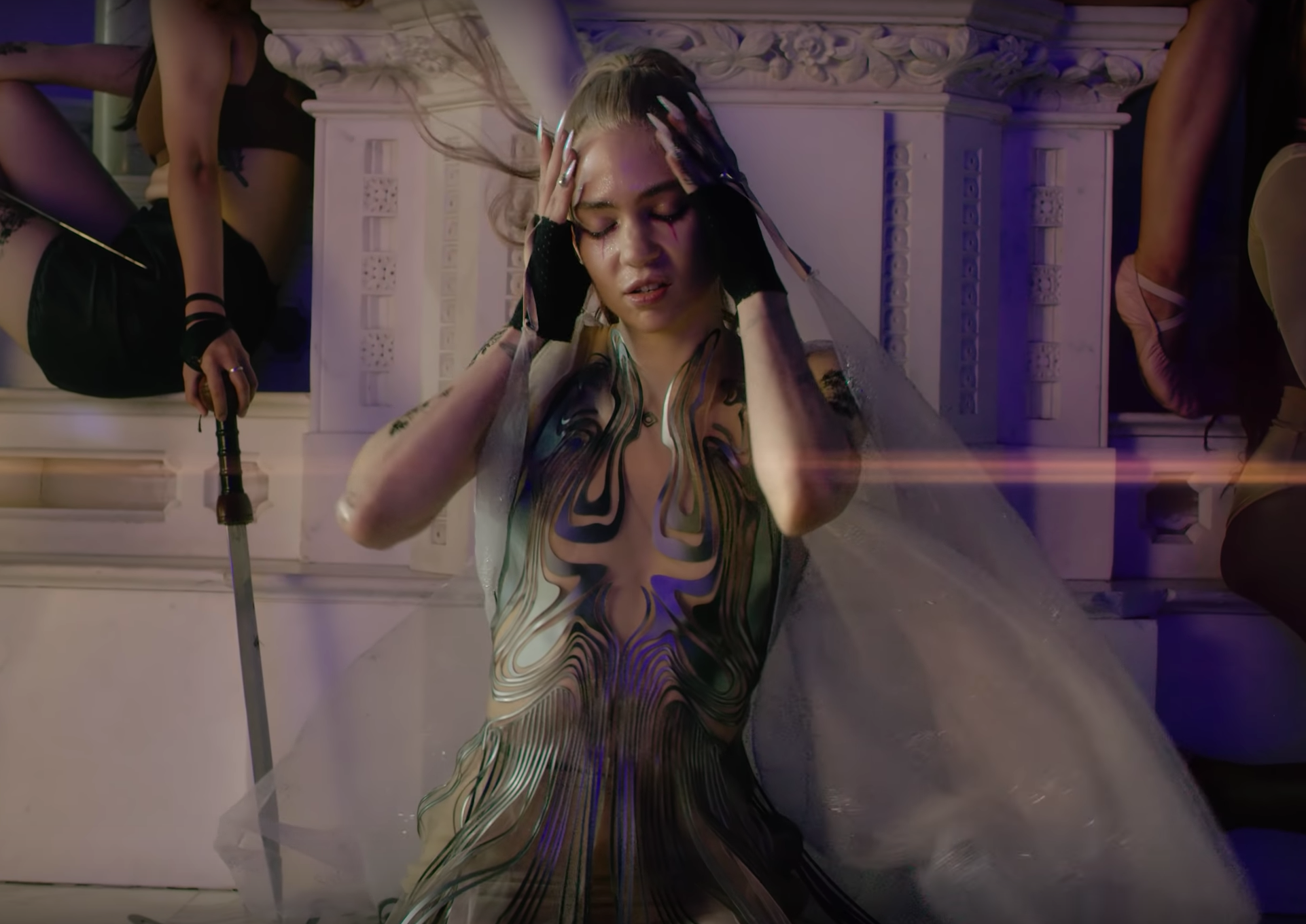 Grimes in the music video for ‘Violence’ (YouTube)