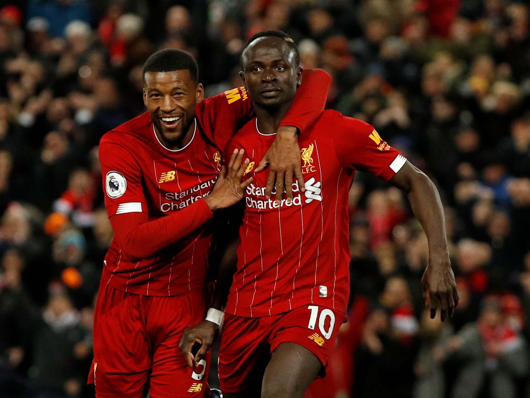 Georginio Wijnaldum celebrates with goalscorer Sadio Mane (Reuters)