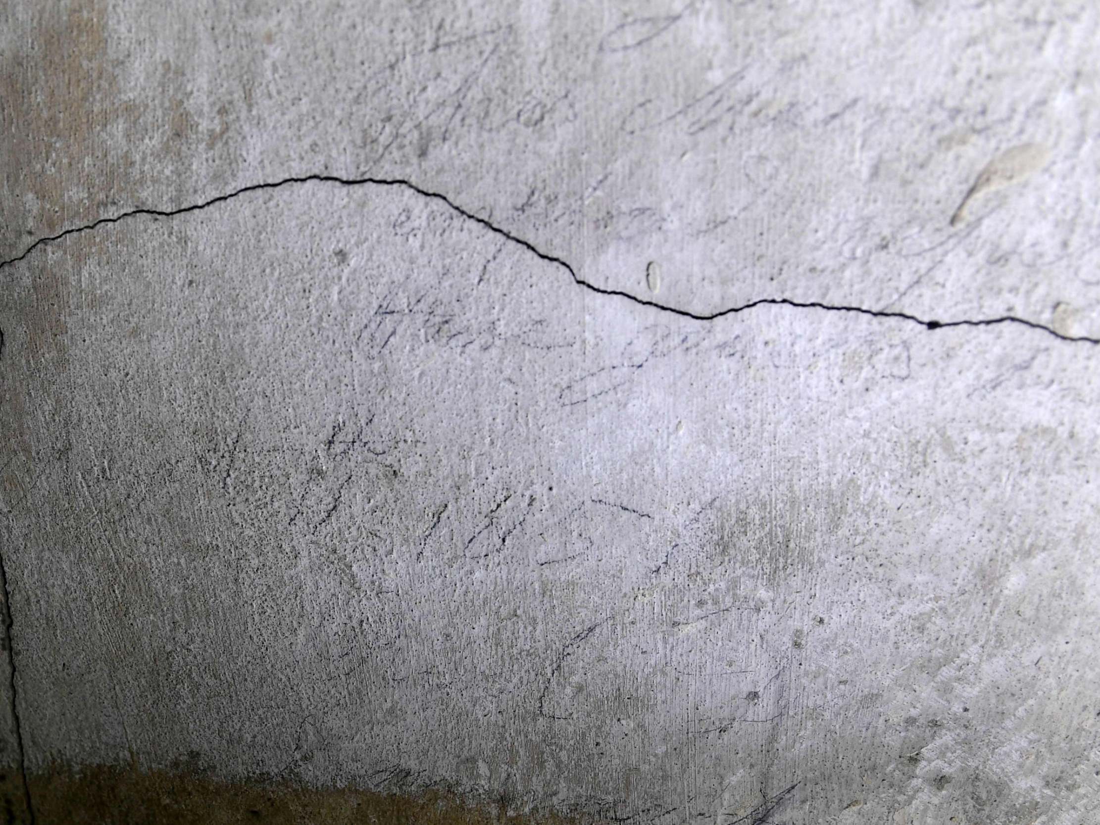 Graffiti written in pencil on the concrete beside the bricked-up 360-year-old passageway (AFP/Getty)