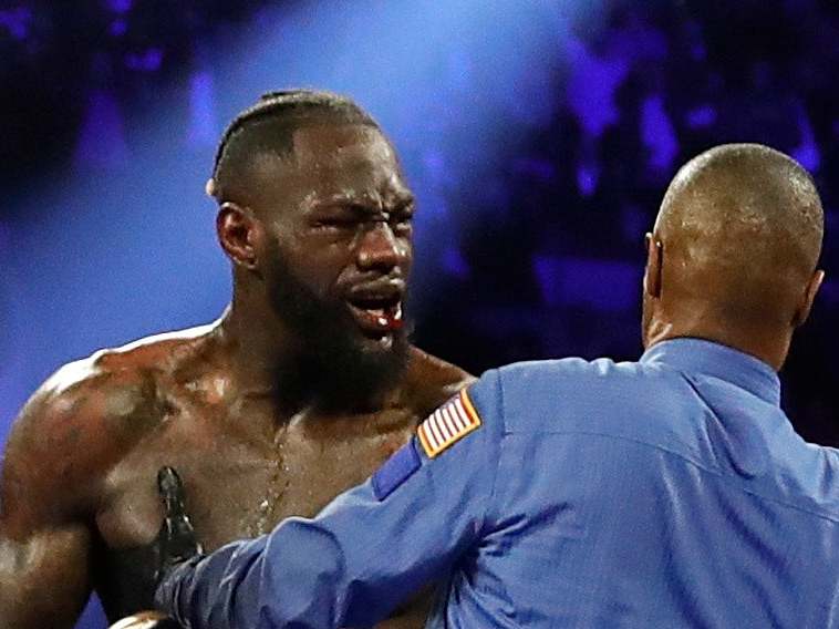 Deontay Wilder remonstrates with referee Kenny Bayliss