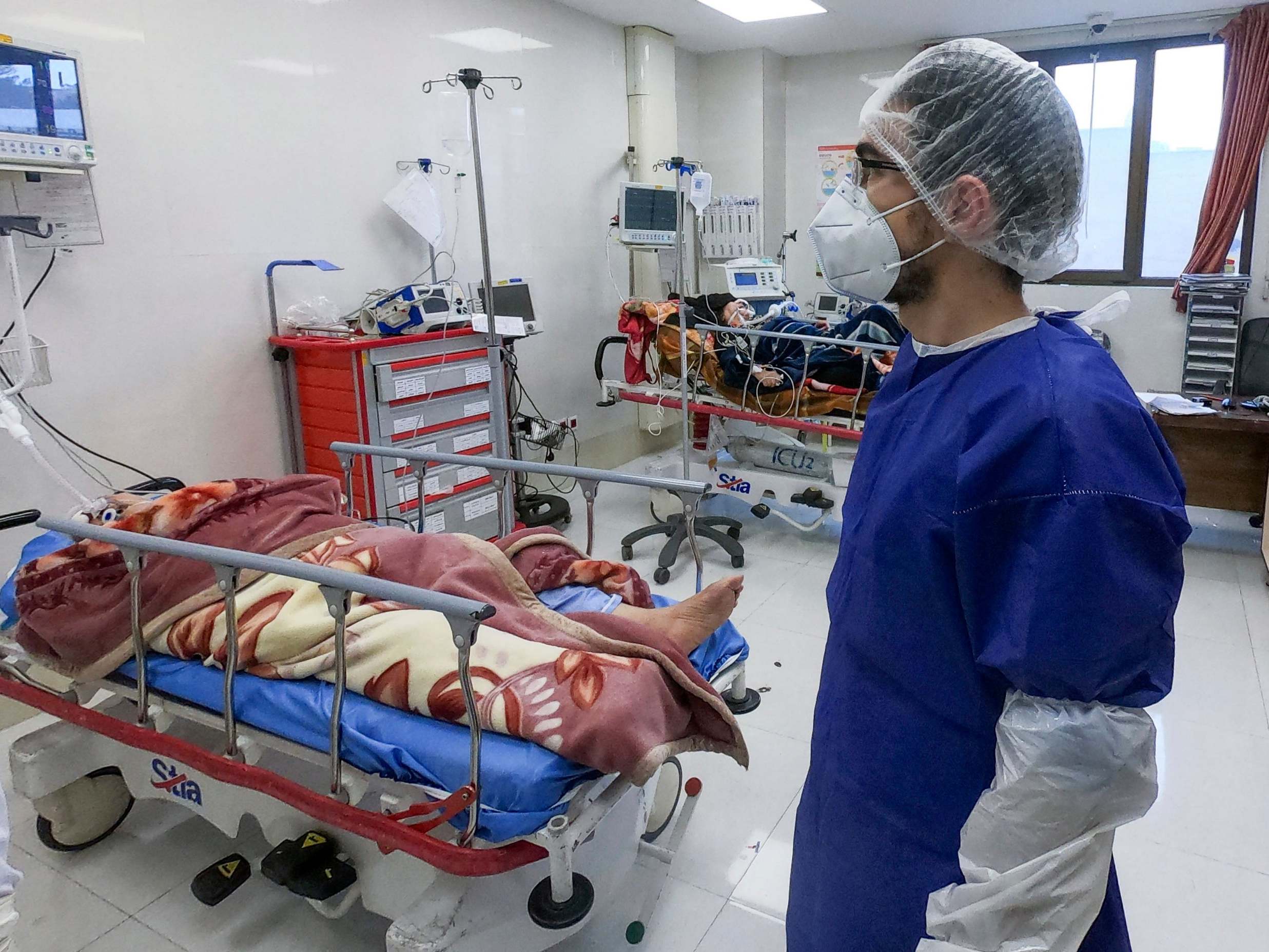 A nurse cares for patients in a coronavirus ward at Forqani Hospital in Qom, Iran