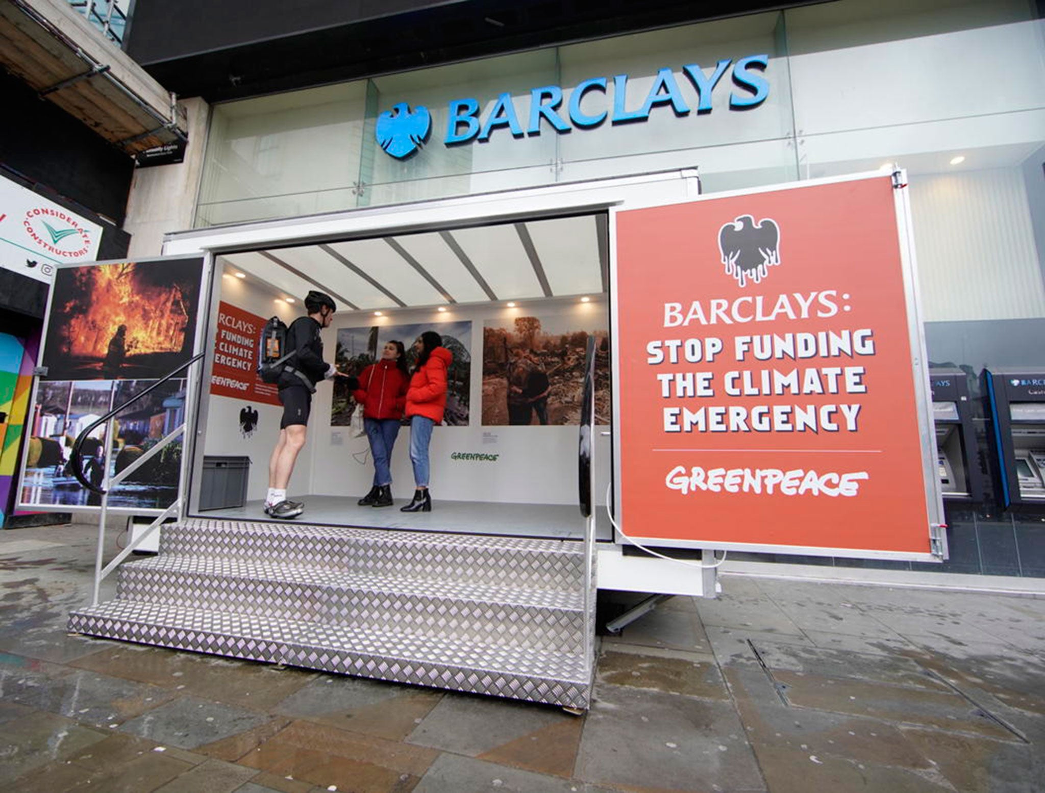 Protesters install pop-up exhibitions in front of the doors of branches