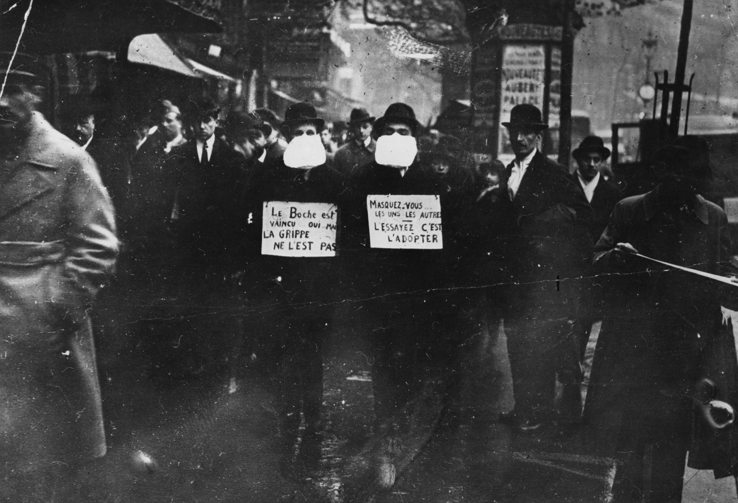Two men advocating the use of flu masks in Paris during the Spanish influenza epidemic in 1919