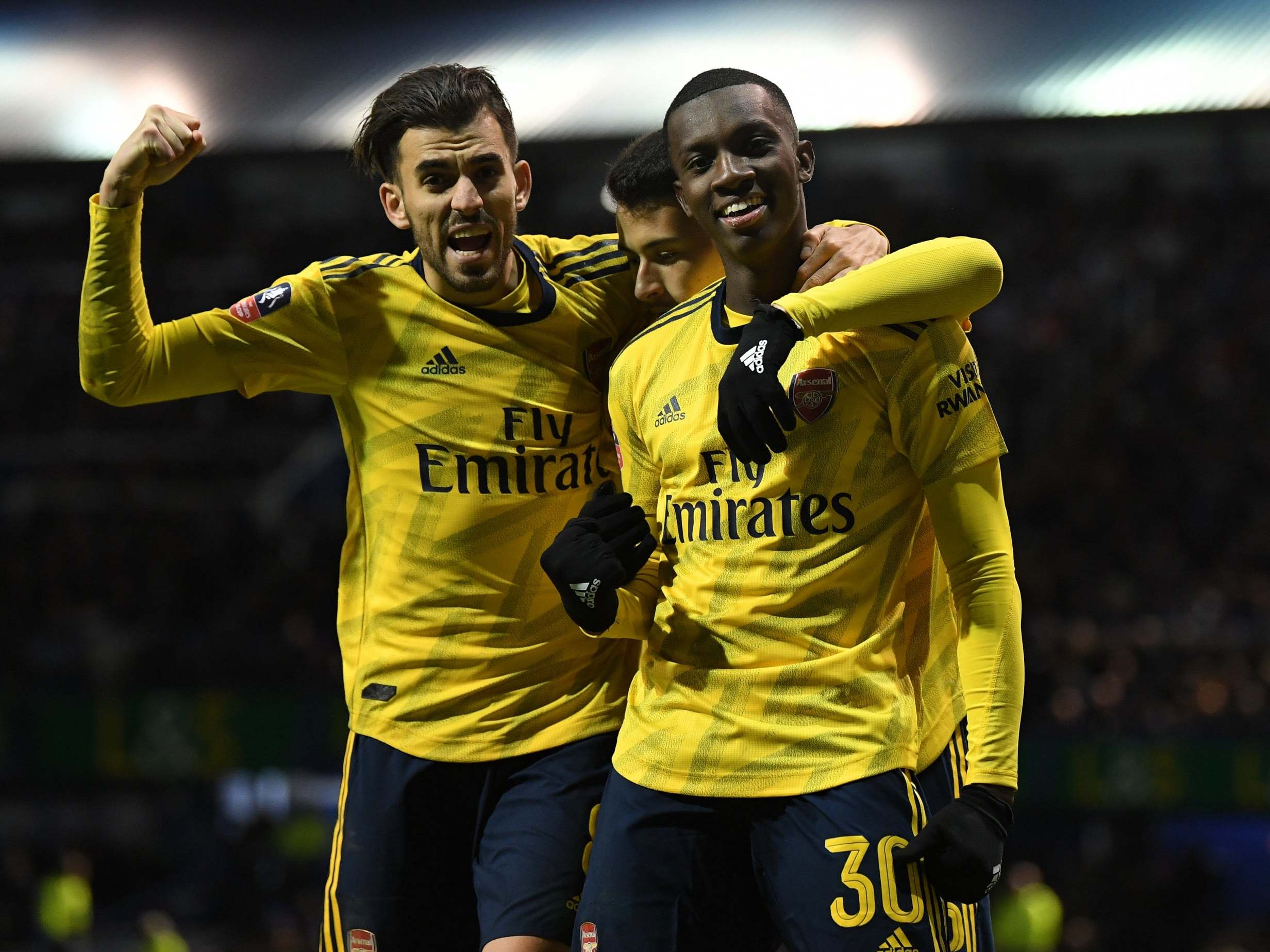 Eddie Nketiah celebrates scoring Arsenal's 2nd goal with Dani Ceballos and Gabriel Martinelli against Portsmouth