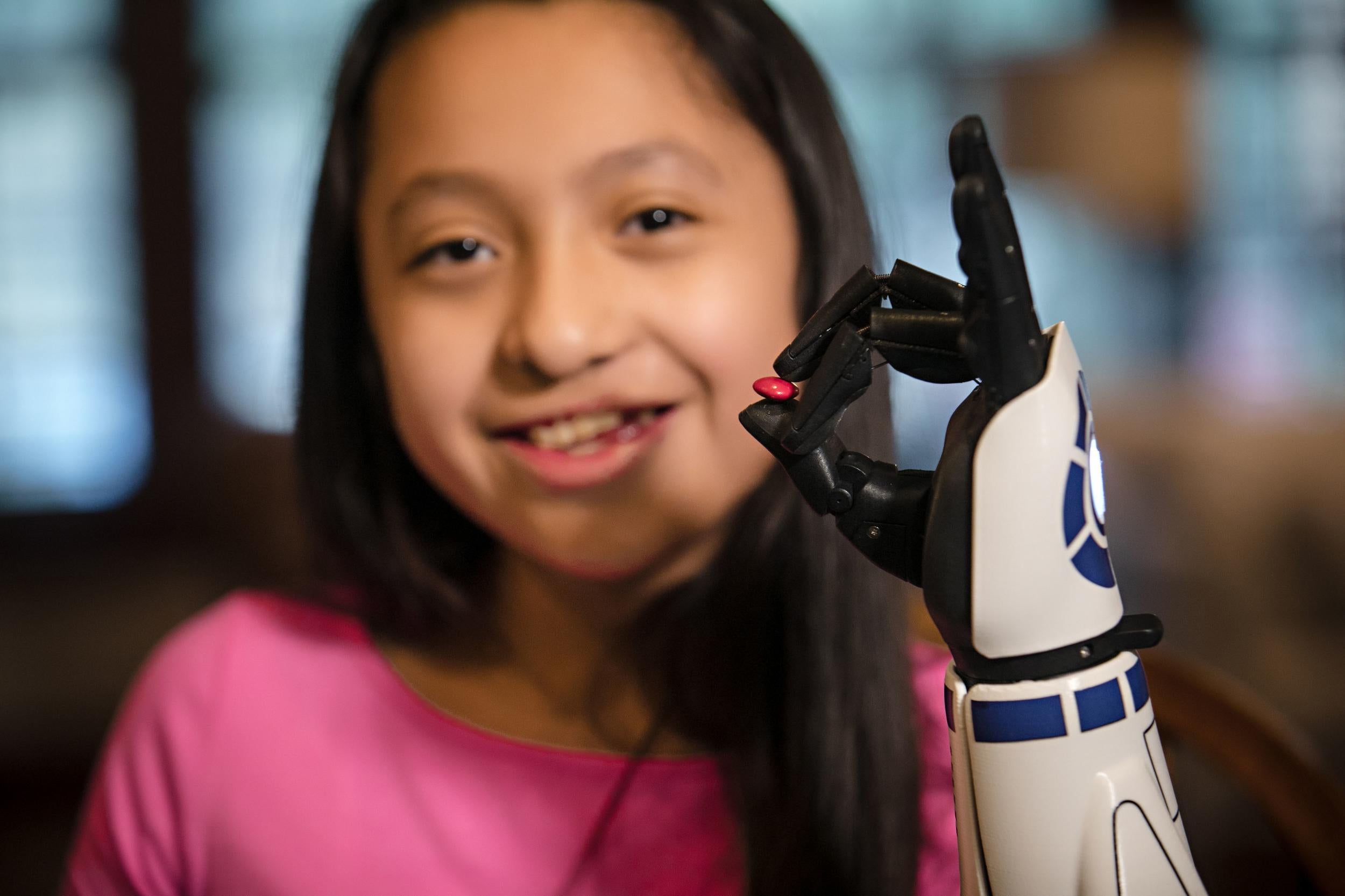 Bella raised almost $14,000 (£11,000) for her bionic 'Hero Arm' (PA)