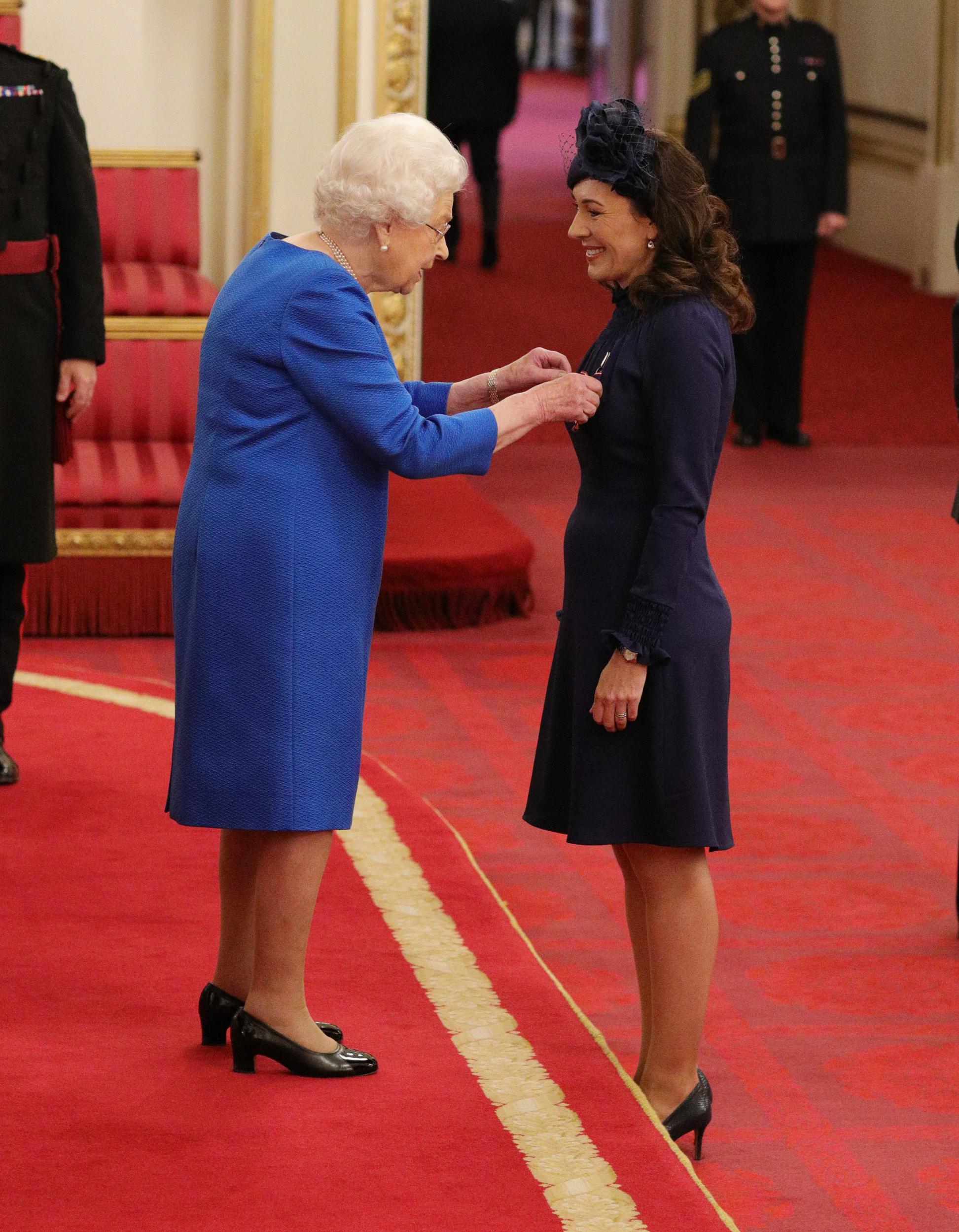 Marnie Gaffney from Kingston-Upon-Thames is made a Member of the Royal Victorian Order by Queen Elizabeth II at Buckingham Palace in November 2019.