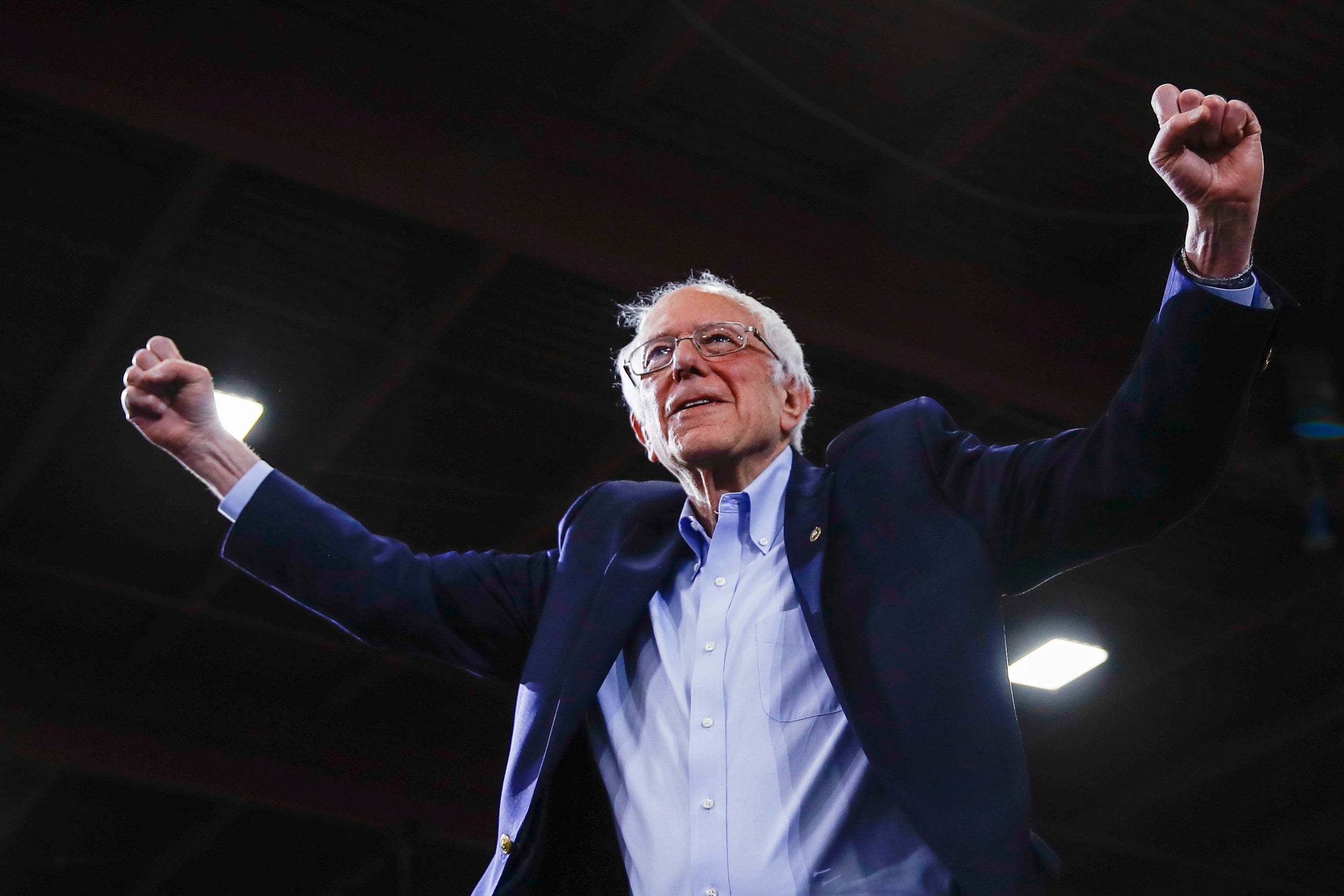 Close-up of Bernie Sanders with his fists raised