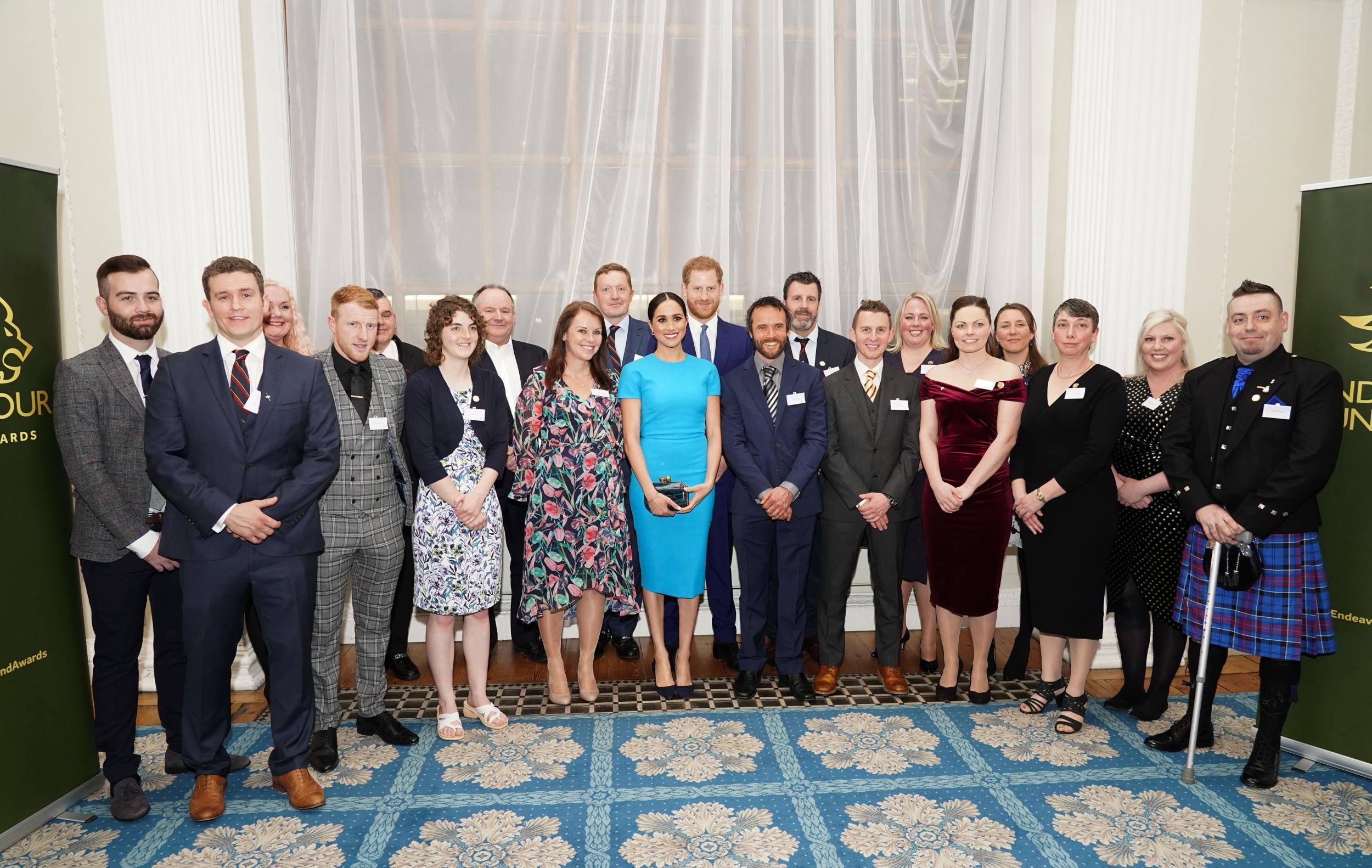 Meghan and Harry pose with attendees at the Endeavour Fund Awards (Getty)