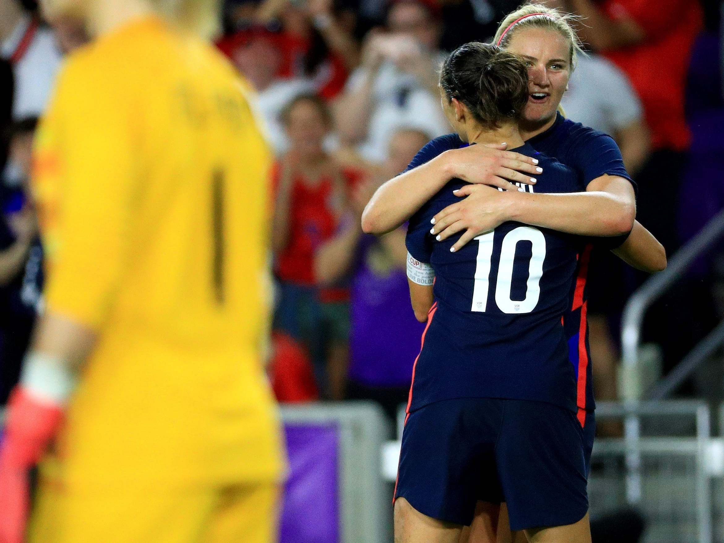 Carli Lloyd celebrates after scoring the second goal to seal victory for the USA over England