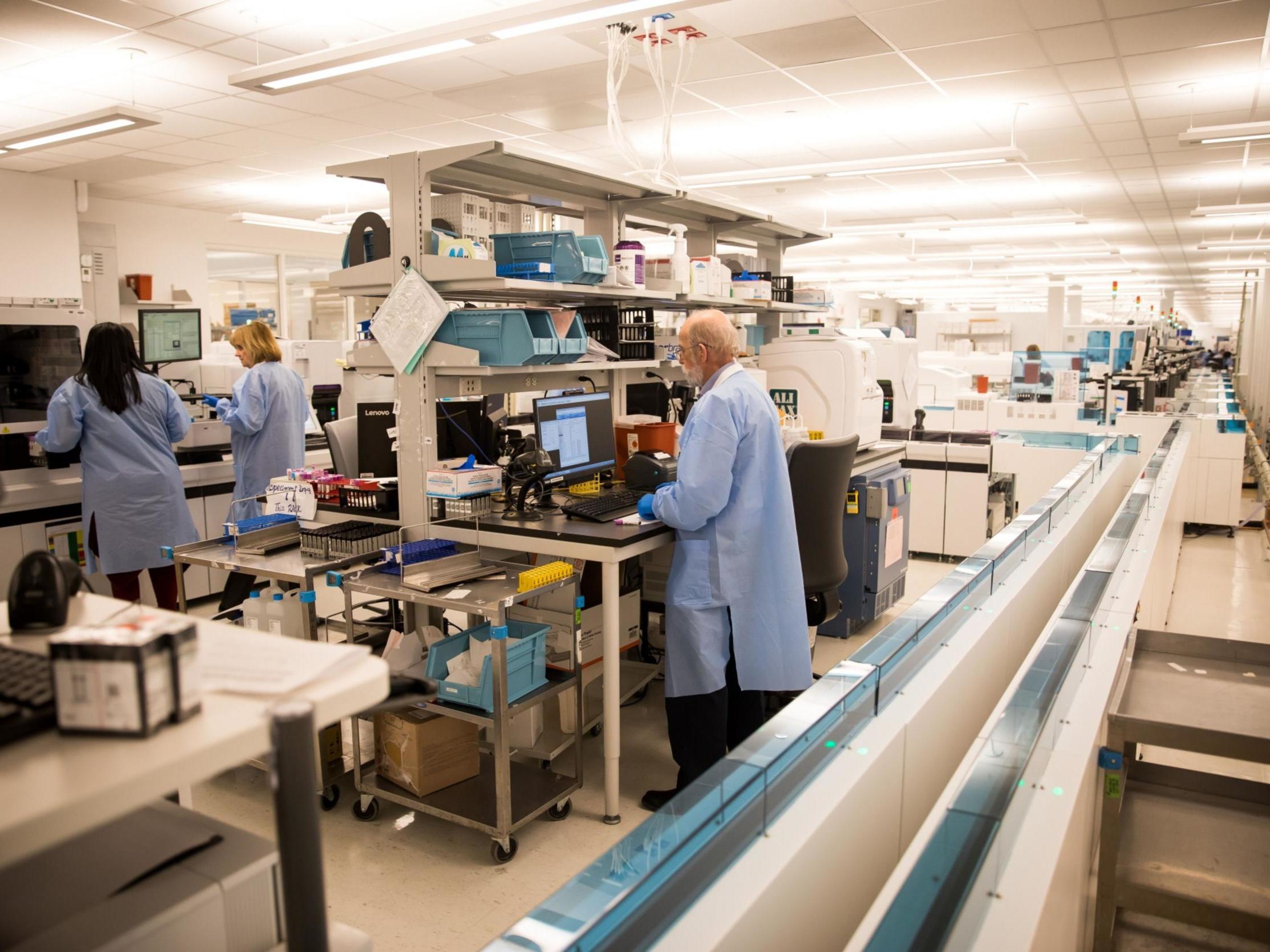 Employees work at Northwell Health Laboratories in Northwell Health’s Center for Advanced Medicine in Lake Success, New York on 4 March 2020.