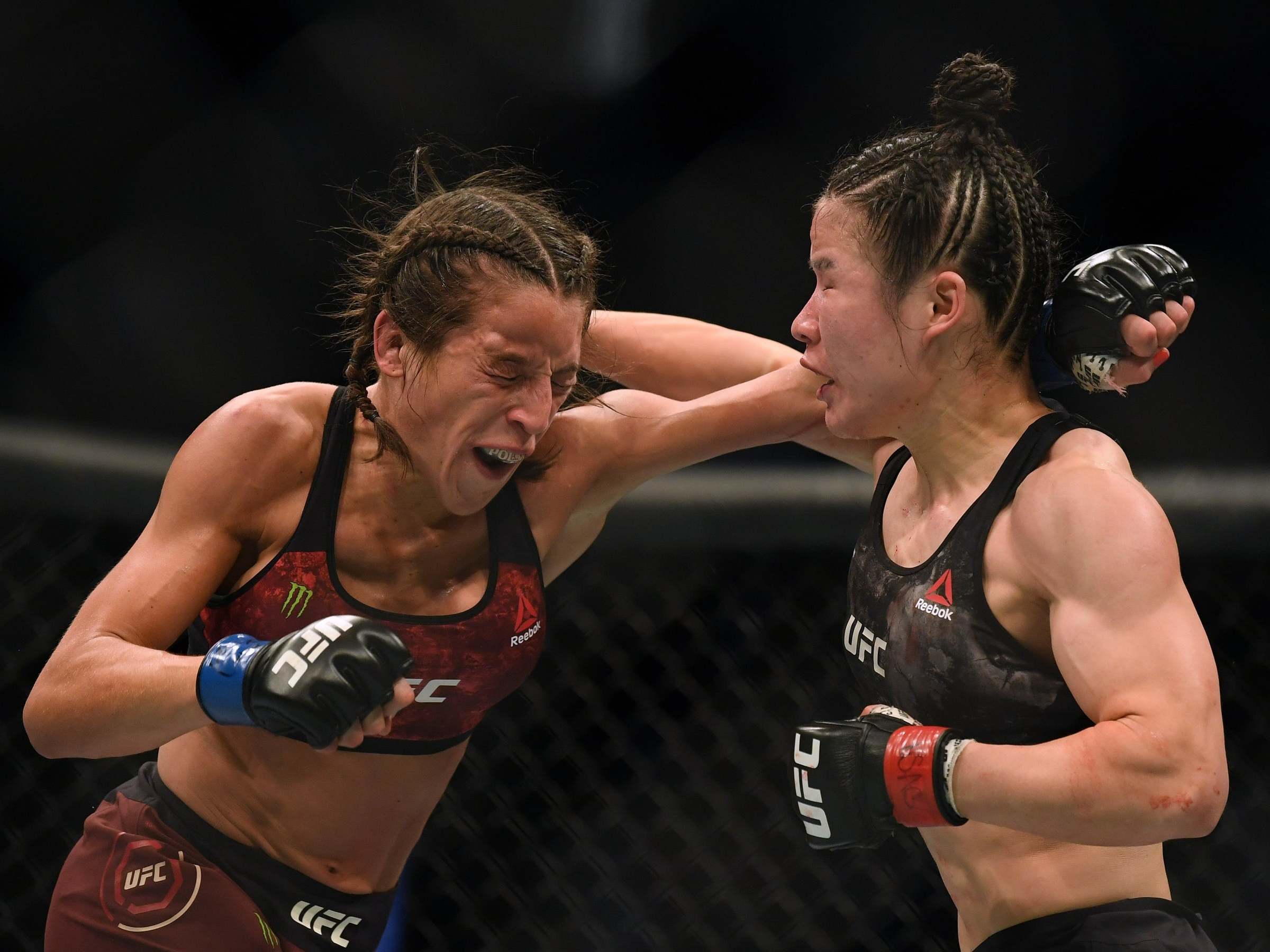 Weili Zhang and Joanna Jedrzejczyk trade shots