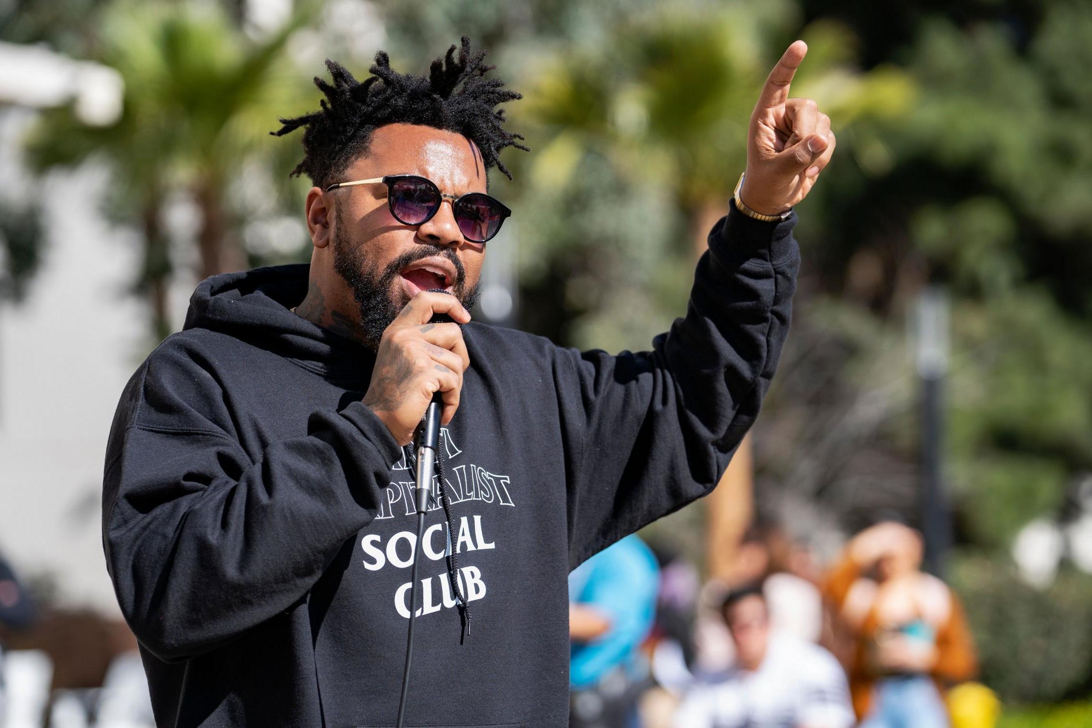 Phillip Agnew speaks as a national surrogate for Democratic Presidential Candidate Bernie Sanders at Cal State University in Fullerton. The event was part of the Bernie 2020 California College Tour.