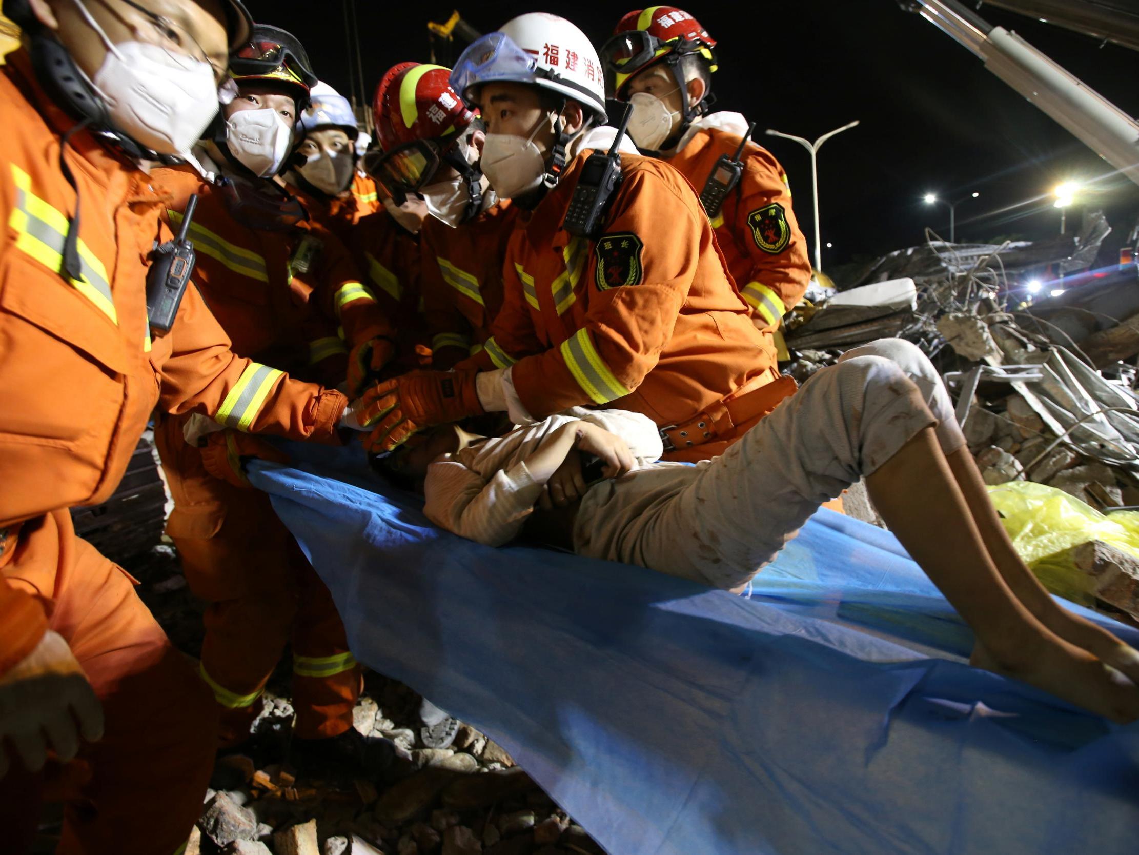 Ten-year-old boy is rescued from the rubble of a collapsed hotel