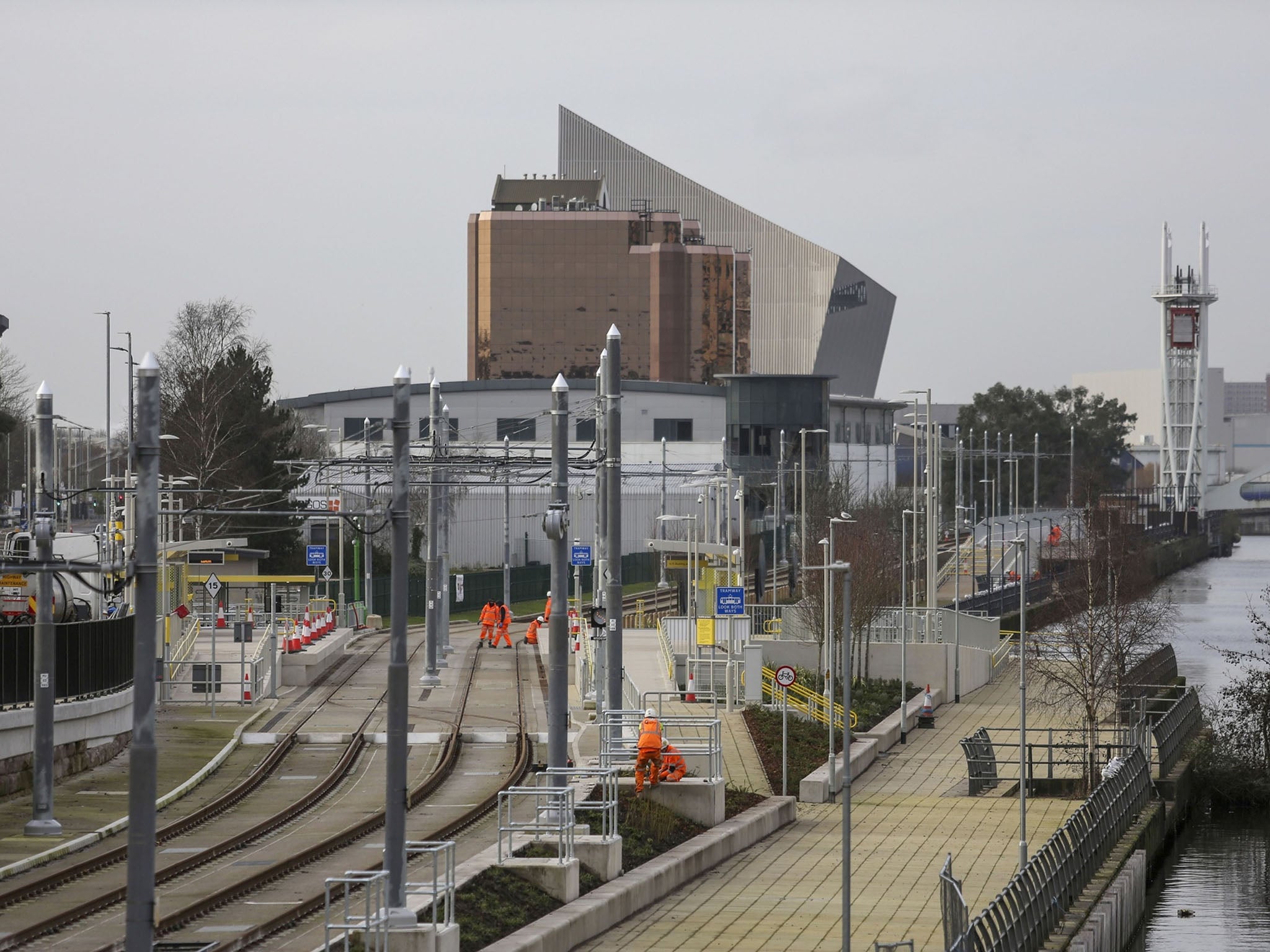 Workmen on the site of the new Wharfside tram stop in Trafford Park