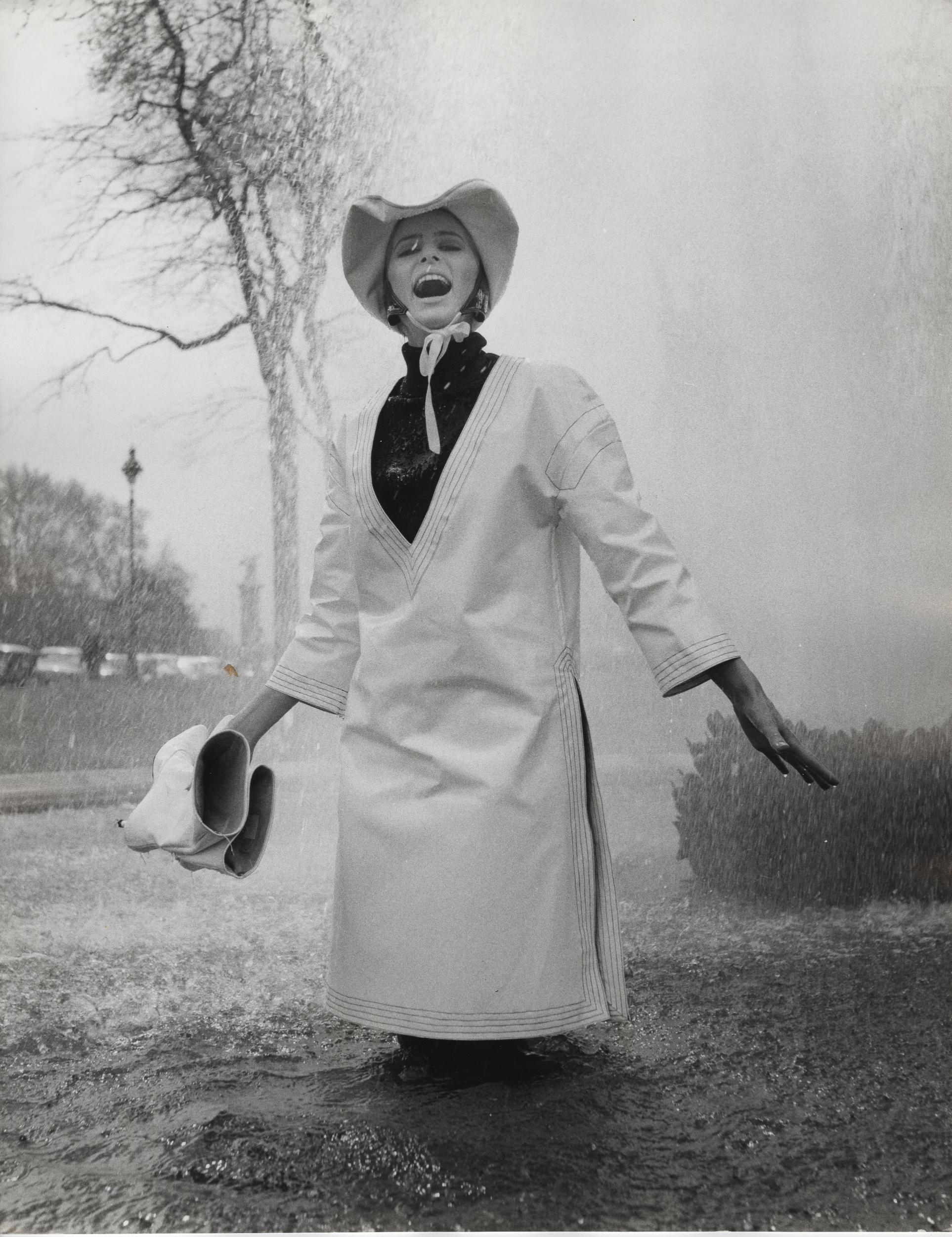 Jill Kennington wearing white PVC rain tunic and hat (John Cowan Archive via V&amp;A Dundee)