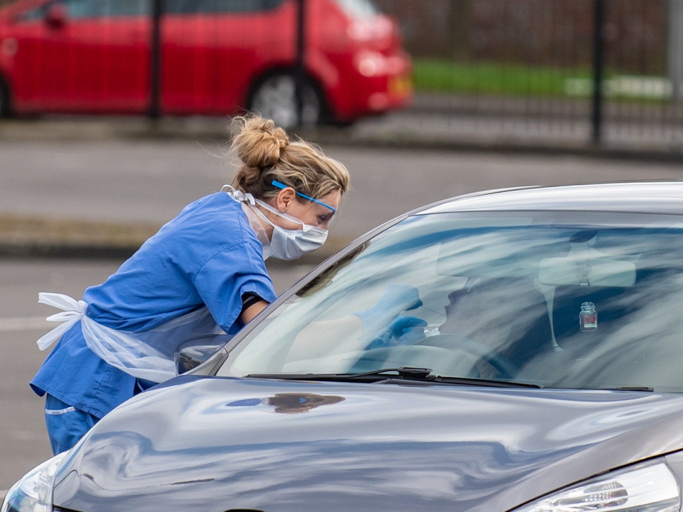 People are being swabbed at drive-thru testing stations all over the world like this one in Wolverhampton (SWNS)