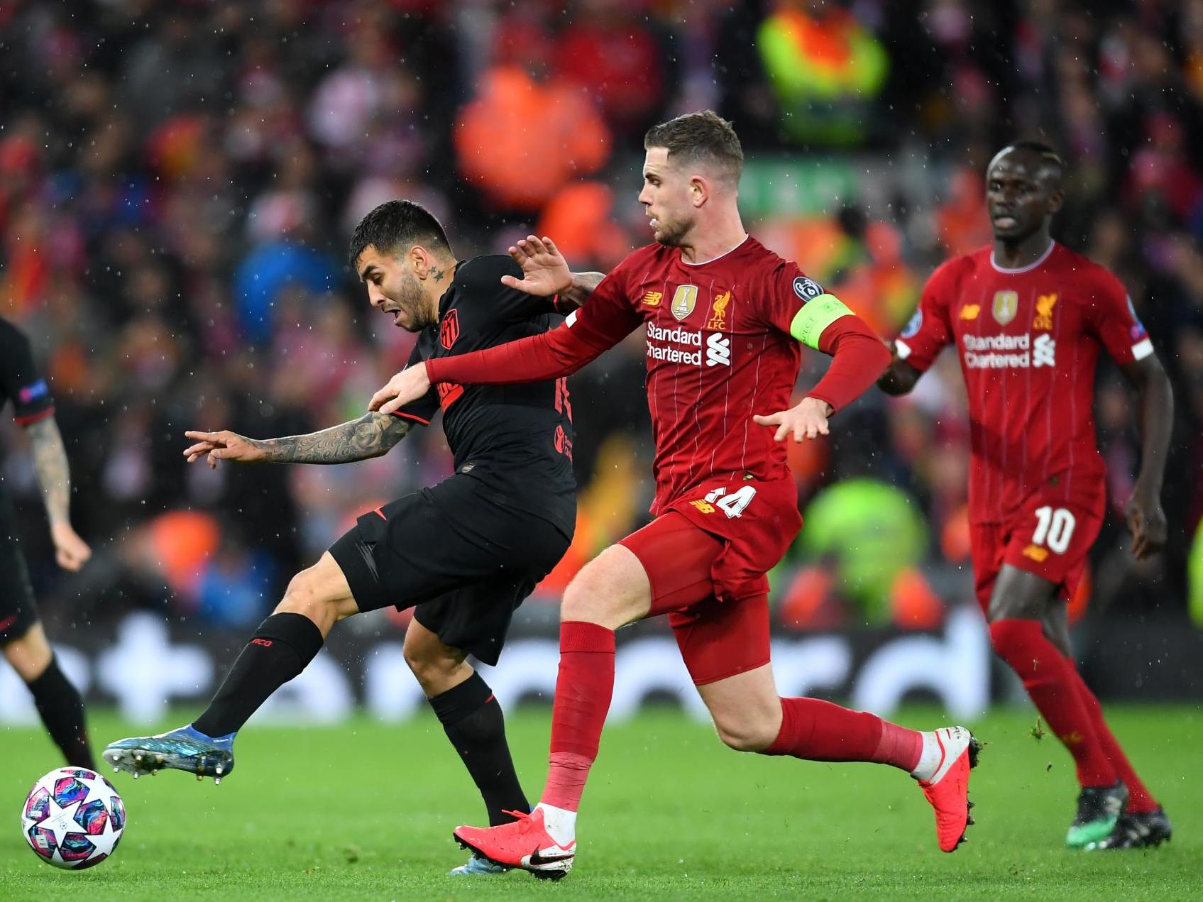 Henderson battles for the ball as Liverpool play Atletico