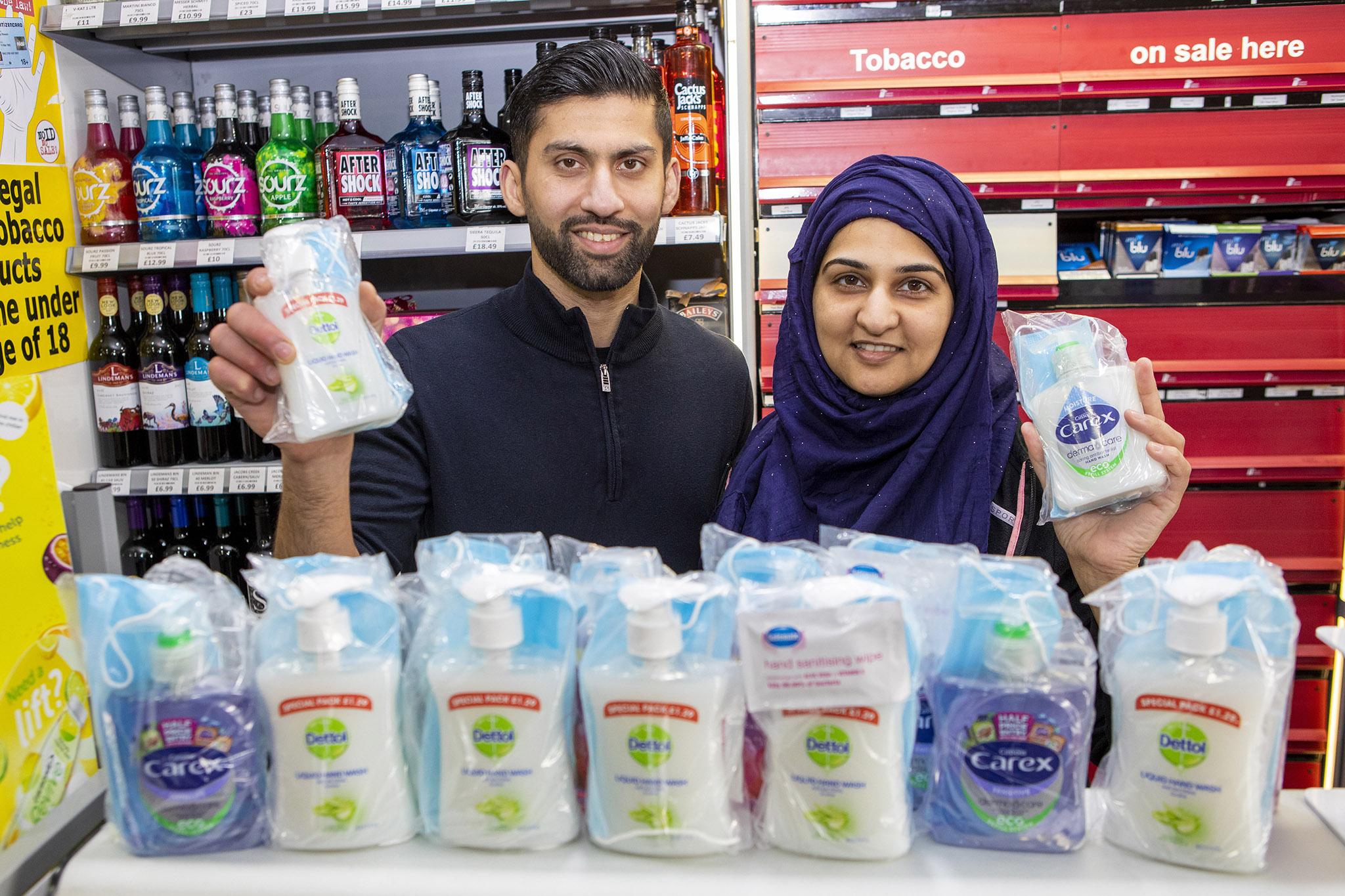 Shopkeepers Asiyah Javed and husband Jawad from Day Today Express, in Stenhousemuir, Falkirk are giving away facemasks, antibacterial hand wash and cleaning wipes to the elderly in a bid to stop the spread of Coronavirus