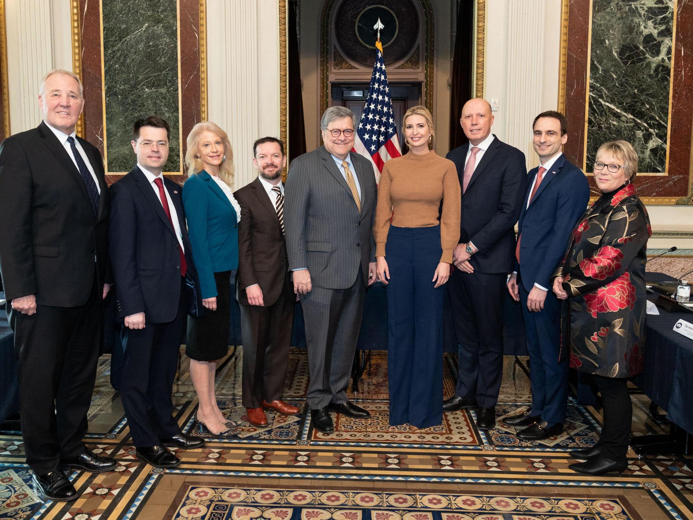 Ivanka Trump stands in between attorney general Bill Bar (left) and Peter Dutton, Australian home affairs minister (right).