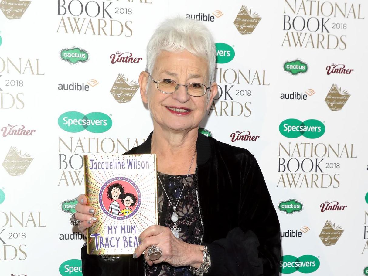 Jacqueline Wilson poses with a Tracy Beaker book