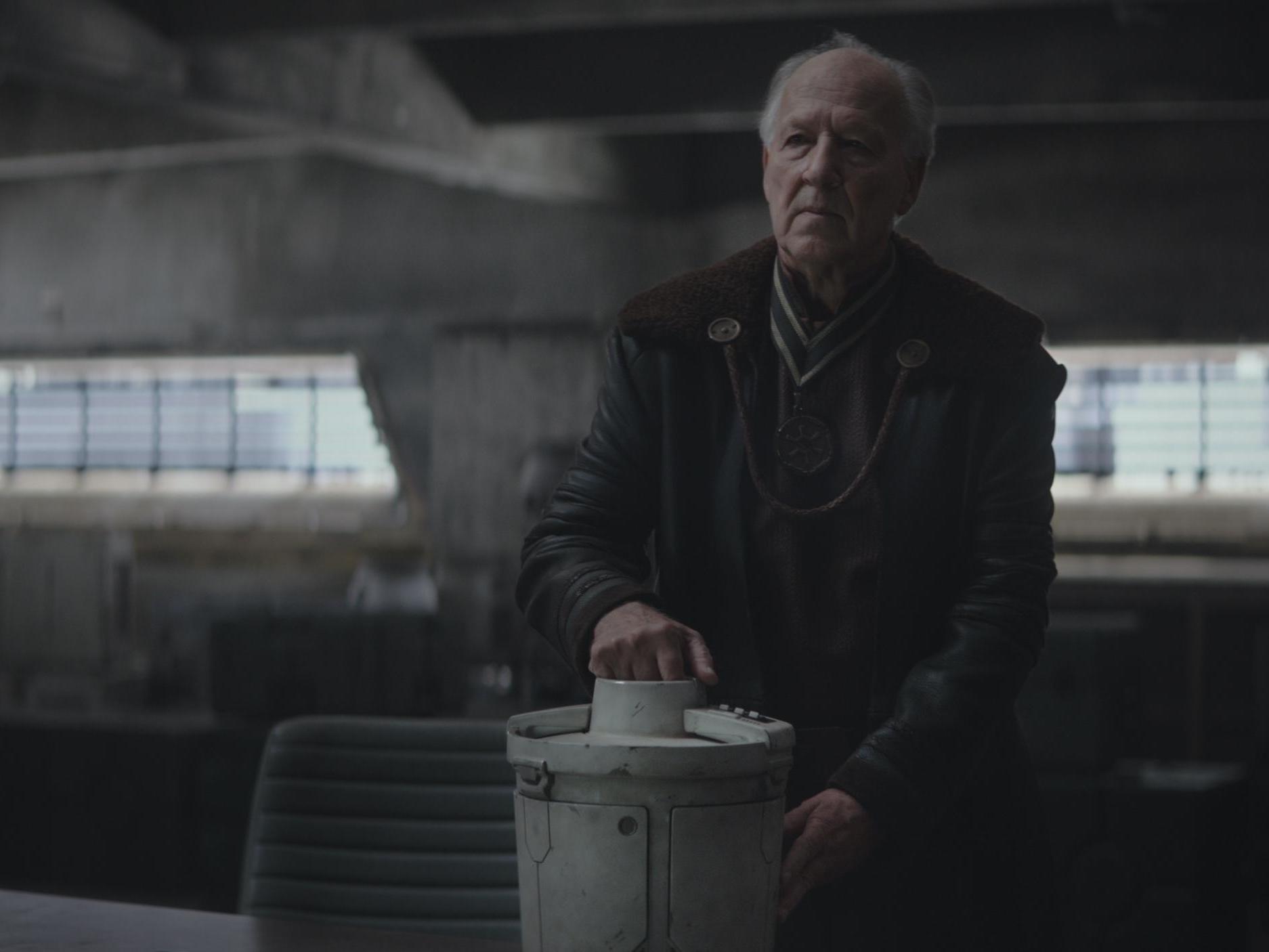 Werner Herzog returns as the Mandalorian’s creepy, enigmatic Client, seen here with a camtono