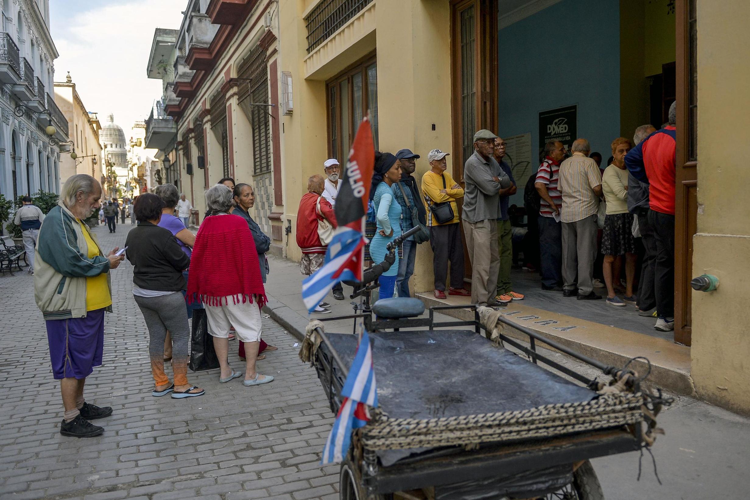 Long queues at shops are a familiar sight (AFP via Getty)