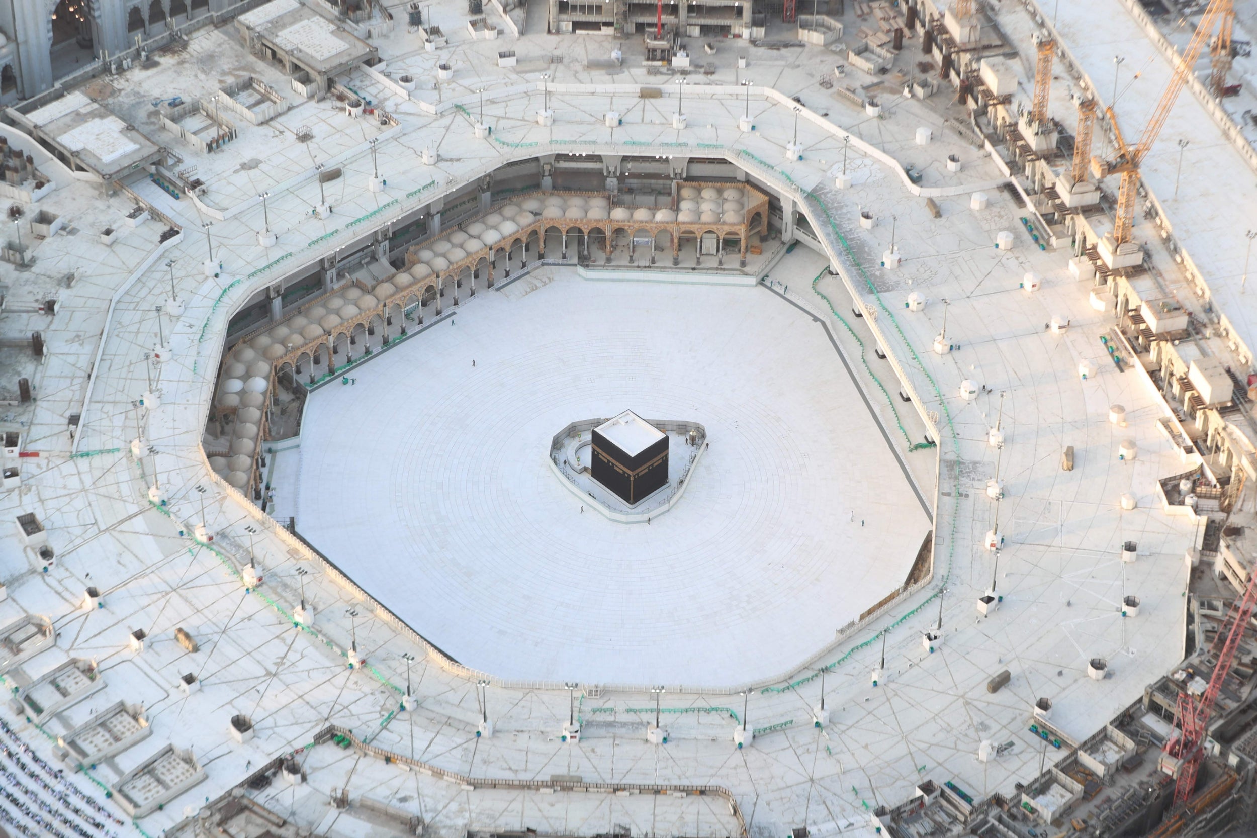 An eerie emptiness enveloped the sacred Kaaba in Mecca's Grand Mosque, Islam's holiest site, where attendance at Friday prayers was hit by measures to protect against coronavirus