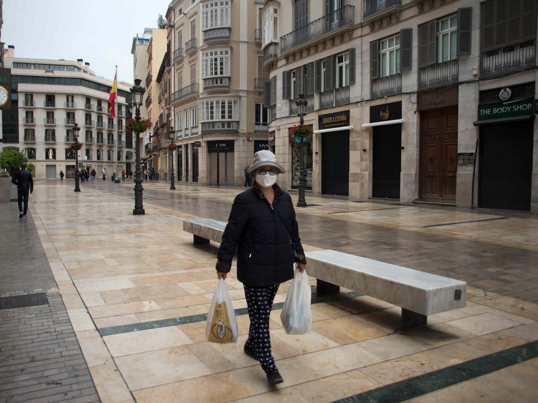 The usually-busy streets of Malaga were almost deserted as the country began its 15-day lockdown last week (AFP)