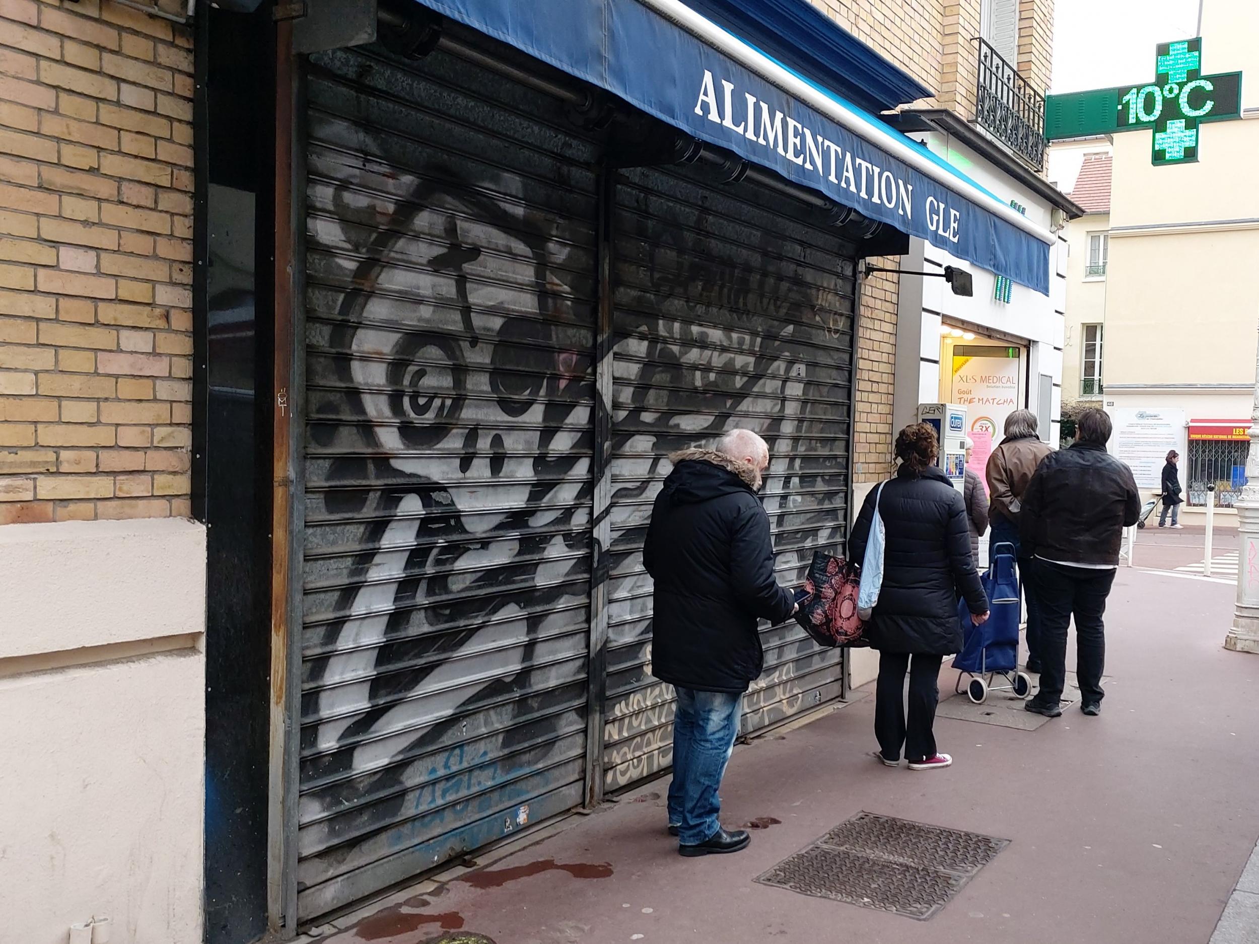 A queue for a pharmacy in Montrouge, Île-de-France, stretches out onto the street on Monday 16 March