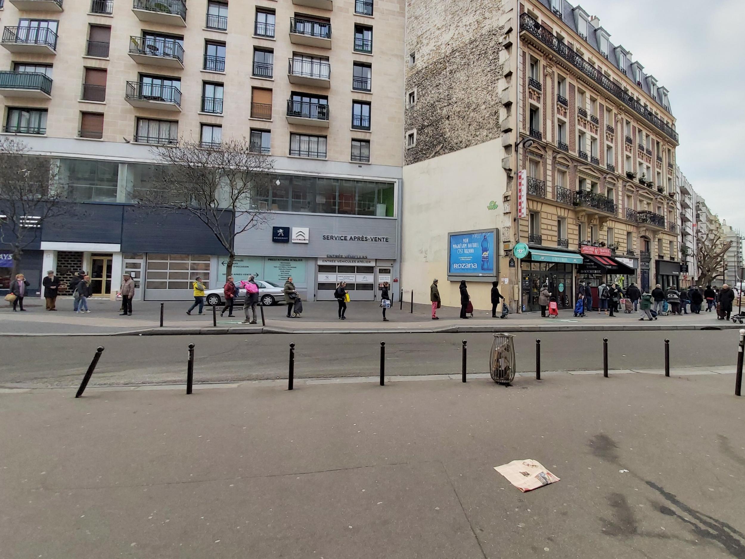 A queue for a supermarket stretches for hundreds of metres in Paris, France, ahead of the midday lockdown, 17 March 2020