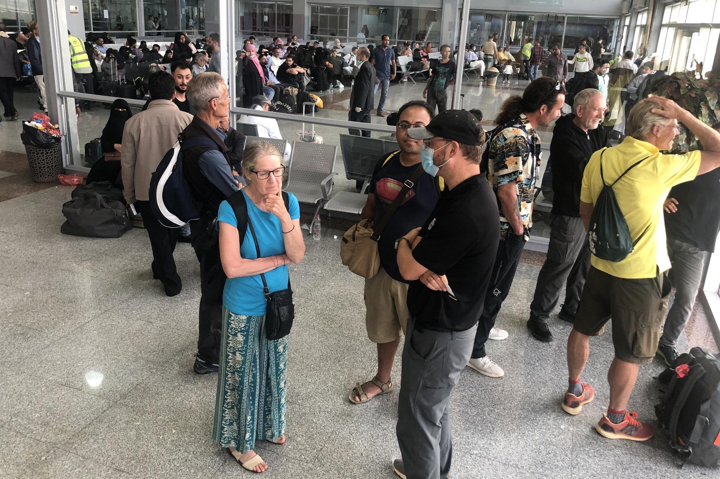 Waiting game: travellers at Aden airport in Yemen ahead of the last flight out