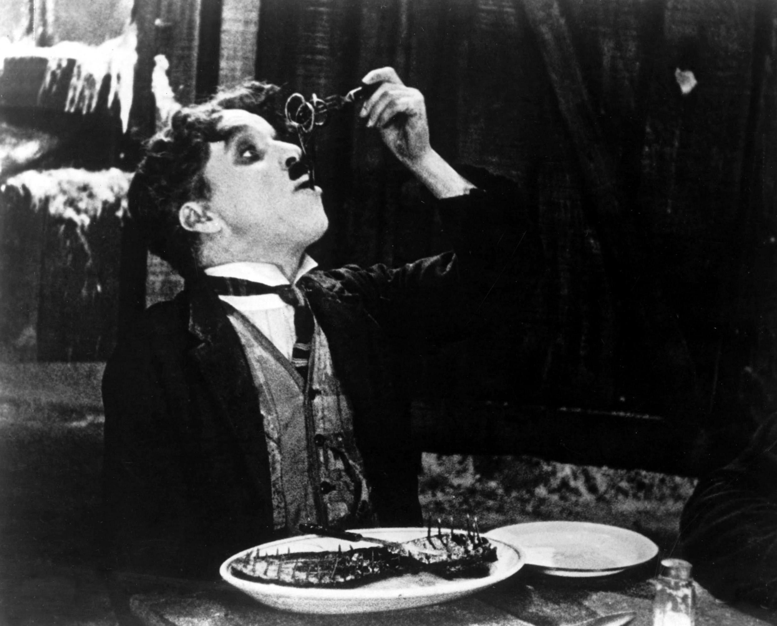 In Charlie Chaplin’s ‘The Gold Rush’ (1925), the bowler-hatted comedian cooks up his own boot after taking refuge from a blizzard