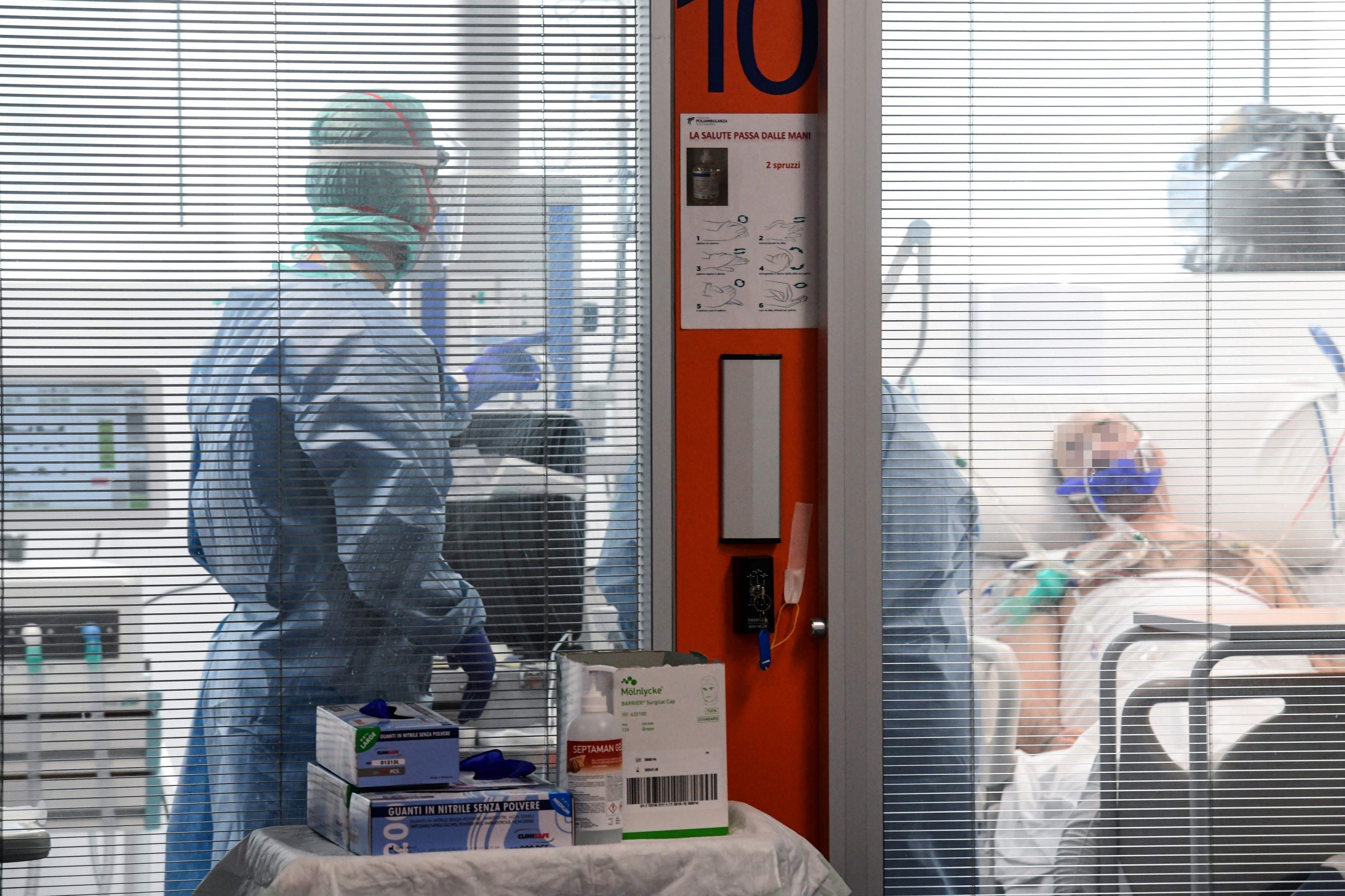 Medical workers attend to patients at Brescia’s Poliambulanza hospital