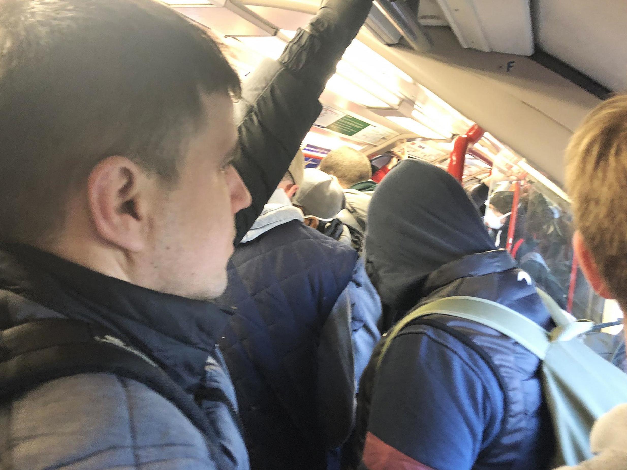 Commuters on a busy train at Leytonstone central station in London on Monday morning