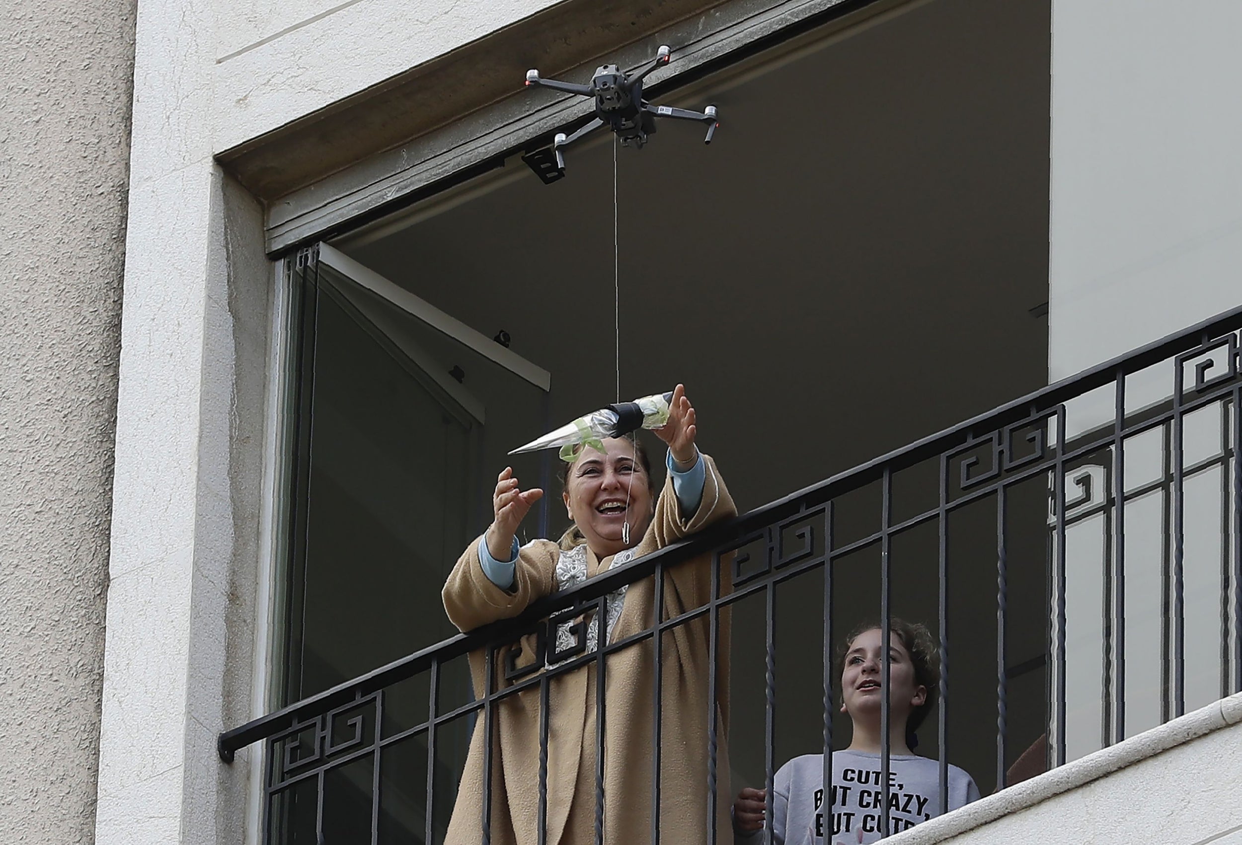 A rose is delivered by drone to a woman on Mother's Day in Jounieh, Lebanon