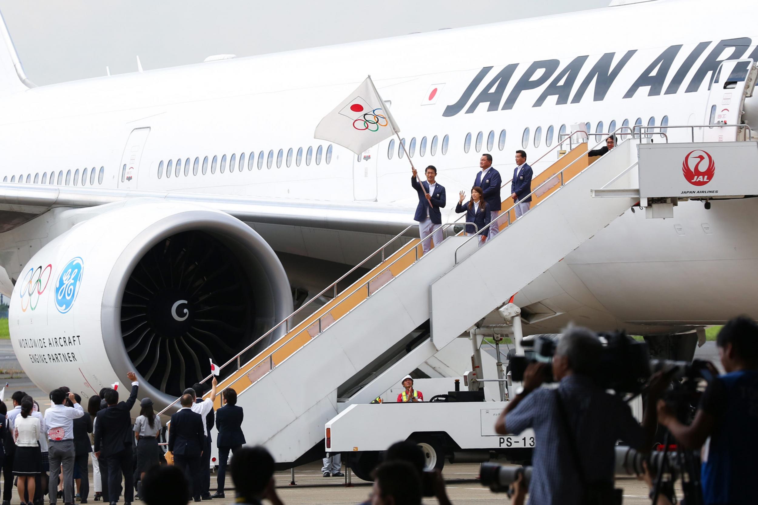 Happier days: the Olympic flag arrives in Tokyo