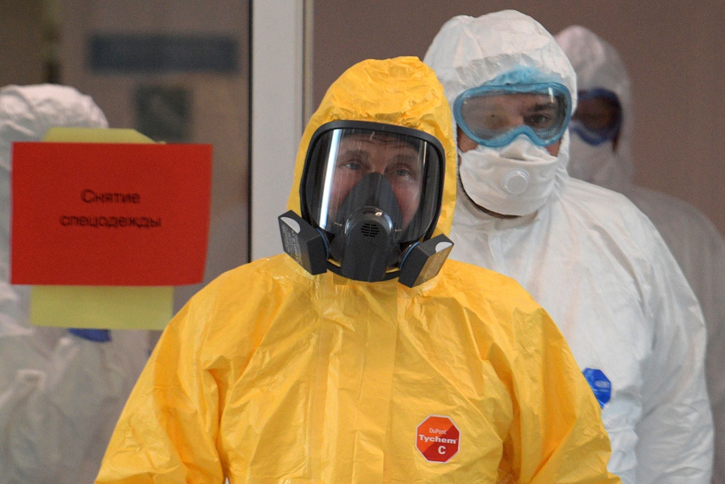 Putin wearing protective gear visits a hospital in Moscow where coronavirus patients are being treated