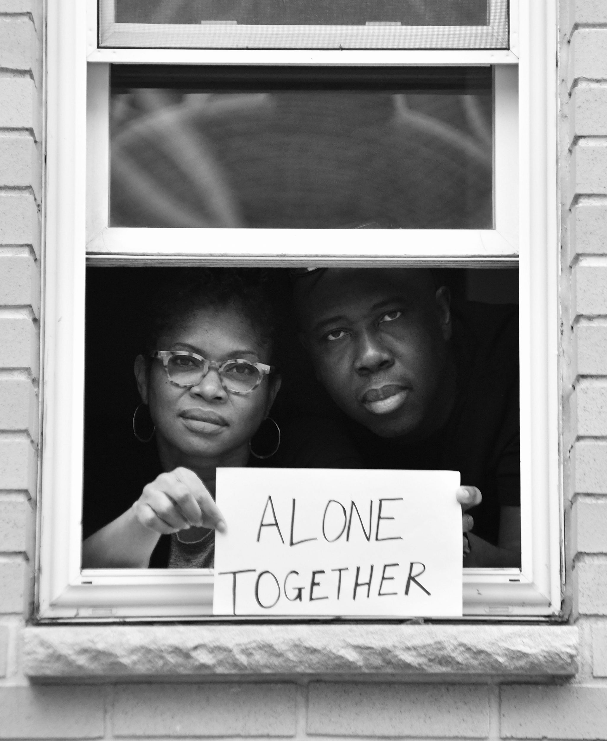 Husband and wife filmmakers, Claire Ince and Ancil McKain pose for a portrait for the series by Shutterstock Staff Photographer, Stephen Lovekin, shot around the Ditmas Park neighborhood of Brooklyn, New York